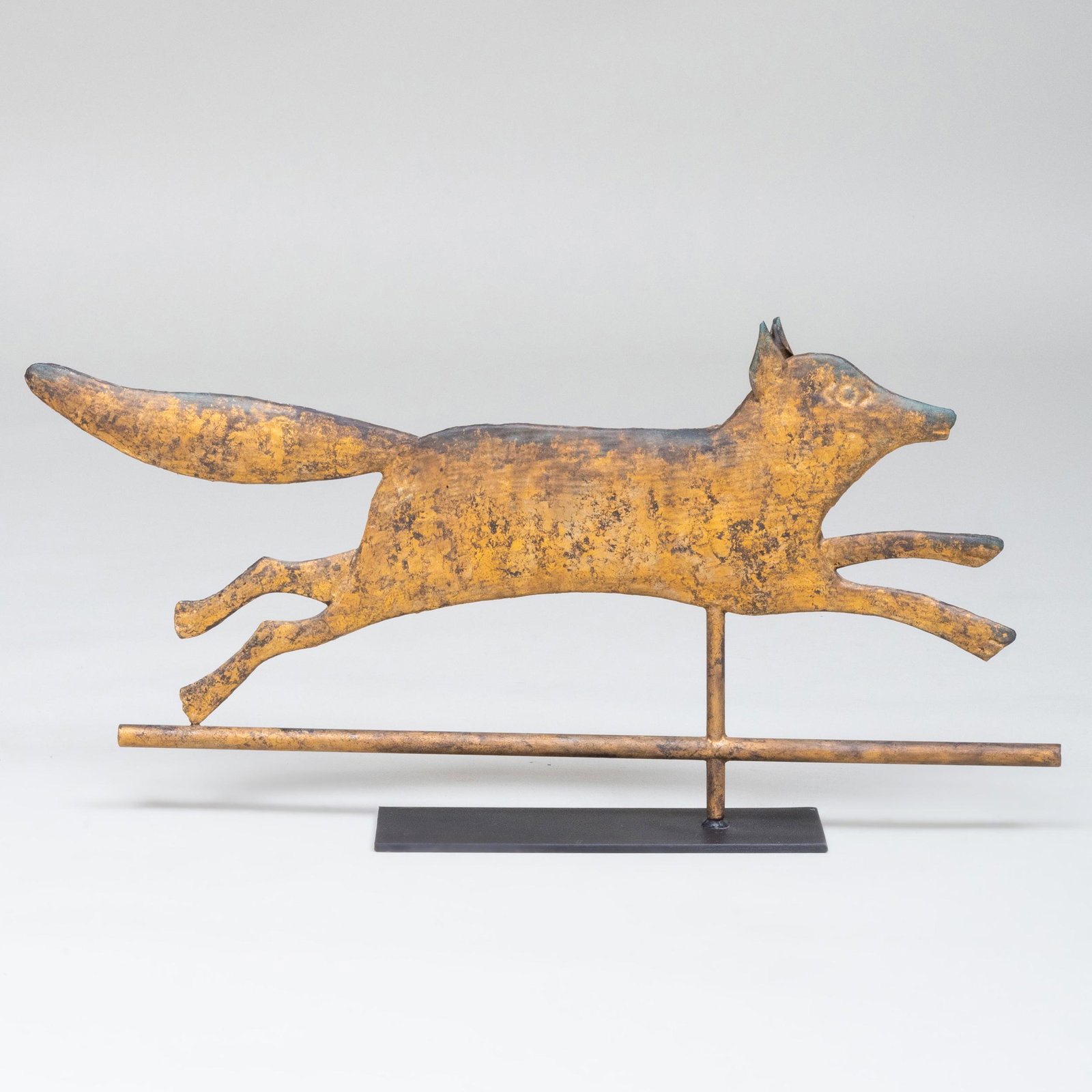 Gilt-Metal Running Fox Weathervane, in the Manner of: Raised on a stand. 14 1/4 x 29 3/4 in.