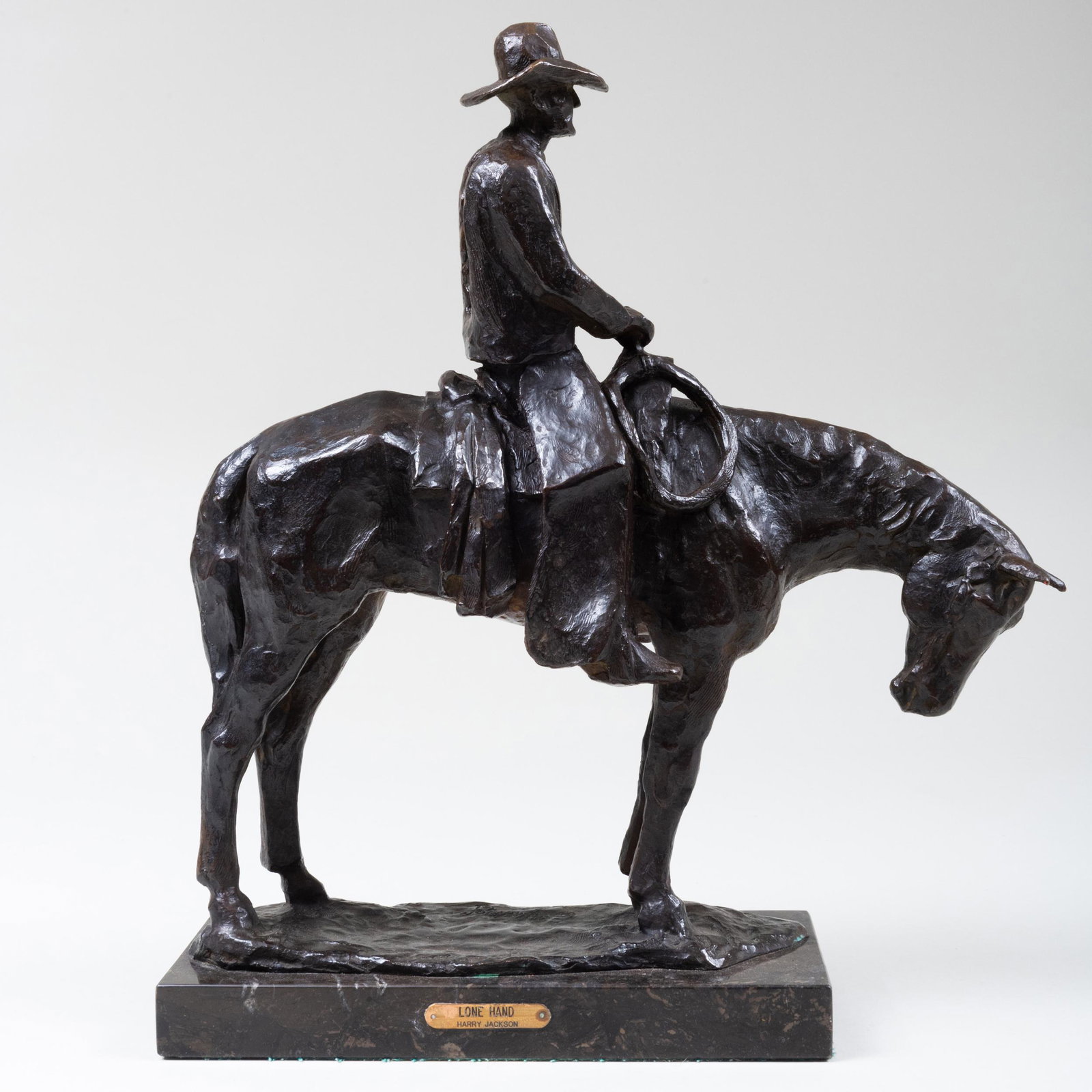Harry Jackson (1924-2011): Lone Hand Bronze, 1961,: Bronze, 1961, with the Harry Jackson copyright and dated at bottom, on a black marble base. 15 1/2 x 13 1/2 x 4 in. (without base).