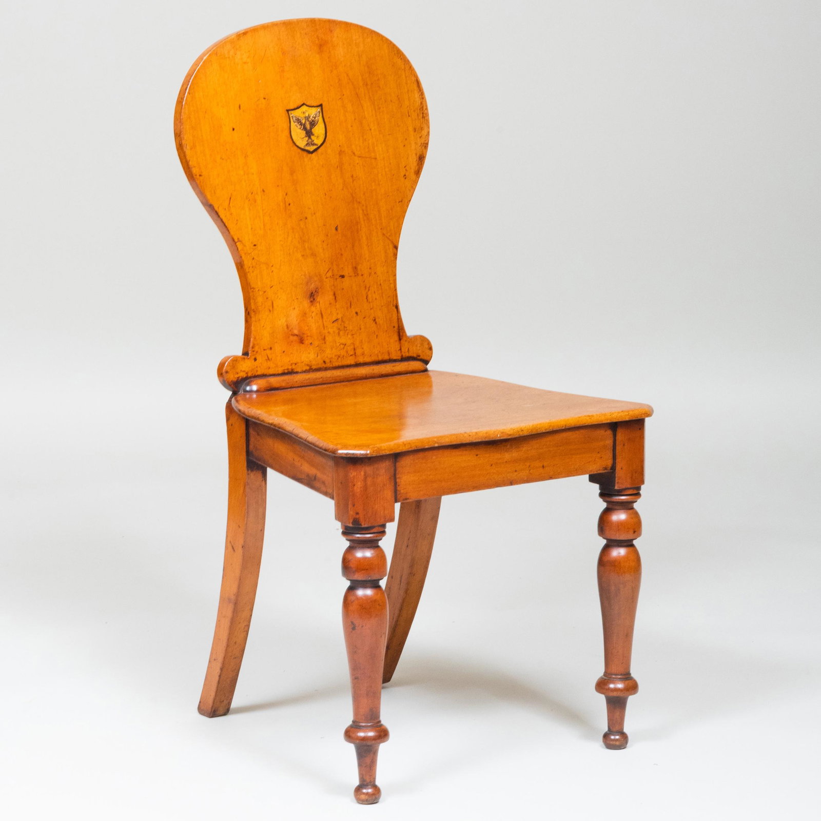 English Oak Hall Chair: English Oak Hall Chair Painted with a central crest. 35 x 18 1/2 x 20 in., height of seat 17 in.