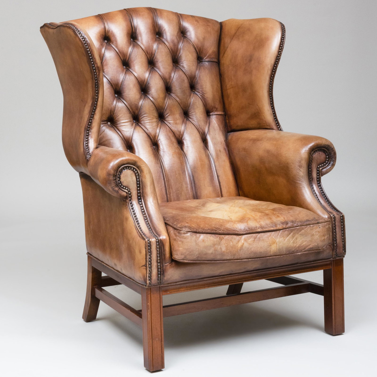 George III Style Mahogany and Leather Wingback Chair: George III Style Mahogany and Leather Wingback Chair 4 ft. 1 in. x 38 x 38 in., height of seat 18 1/2 in.