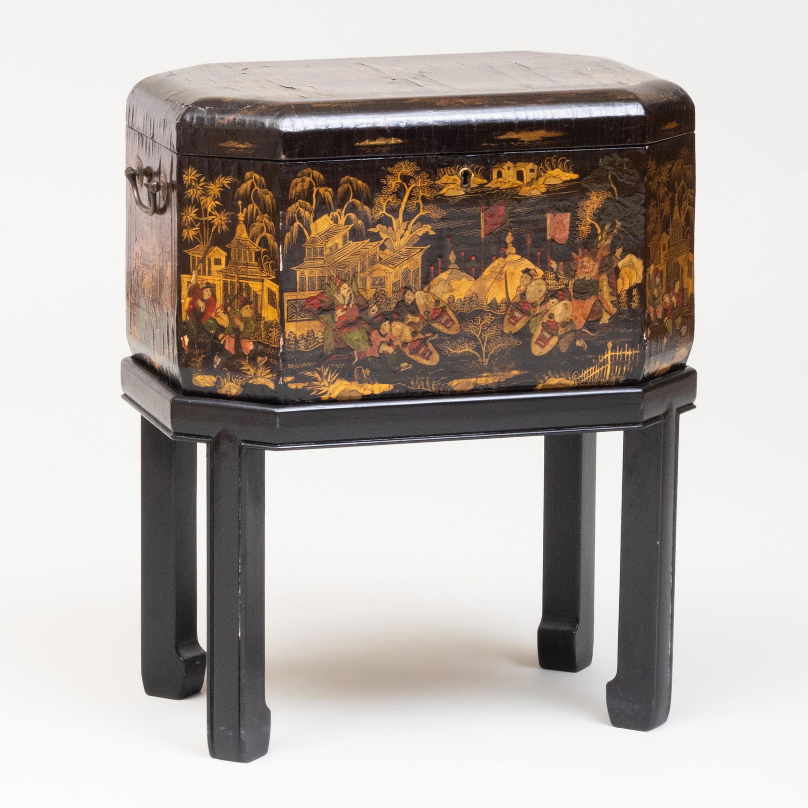 Chinese Black Lacquer and Parcel-Gilt Tea Chest on: Chinese Black Lacquer and Parcel-Gilt Tea Chest on Stand Opening to two metal covered tea caddies, the body flanked by handles, raised on a later stand. 21 x 17 1/2 x 12 in. The Collection of Dr. Dani