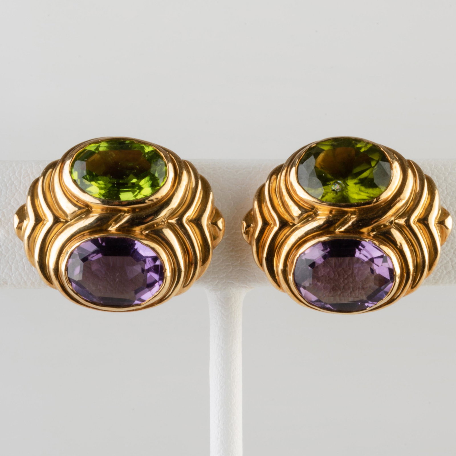 Pair of 18k Gold, Peridot and Amethyst Earrings: Pair of 18k Gold, Peridot and Amethyst Earrings Marked '18k'. 3/4 x 7/8 in., 10.1 dwts.