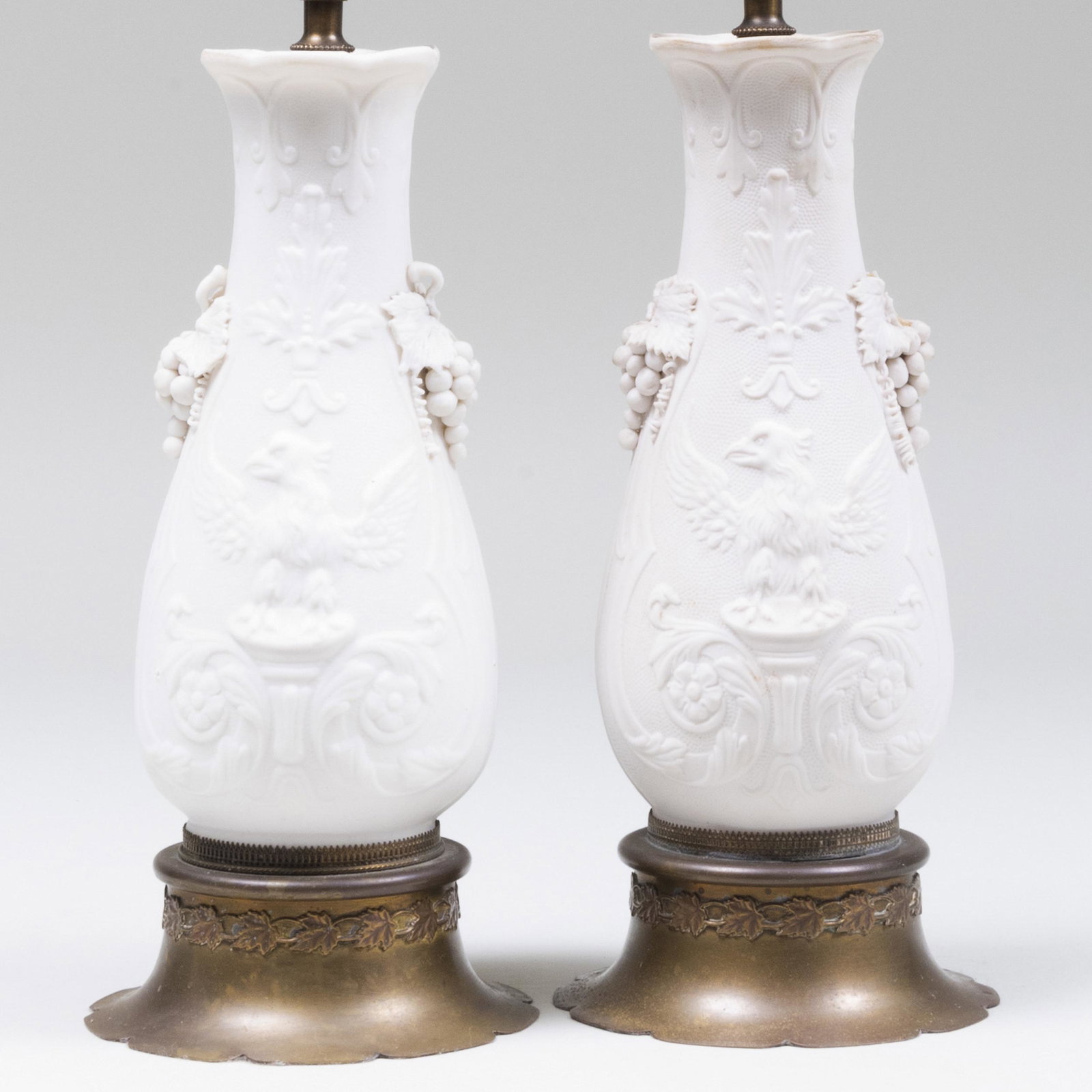Pair of Continental Biscuit Vases Mounted as Lamps: Pair of Continental Biscuit Vases Mounted as Lamps The vases 9 3/4 x 4 1/4 in. diam., 15 x 4 1/4 in. diam. (to socket).