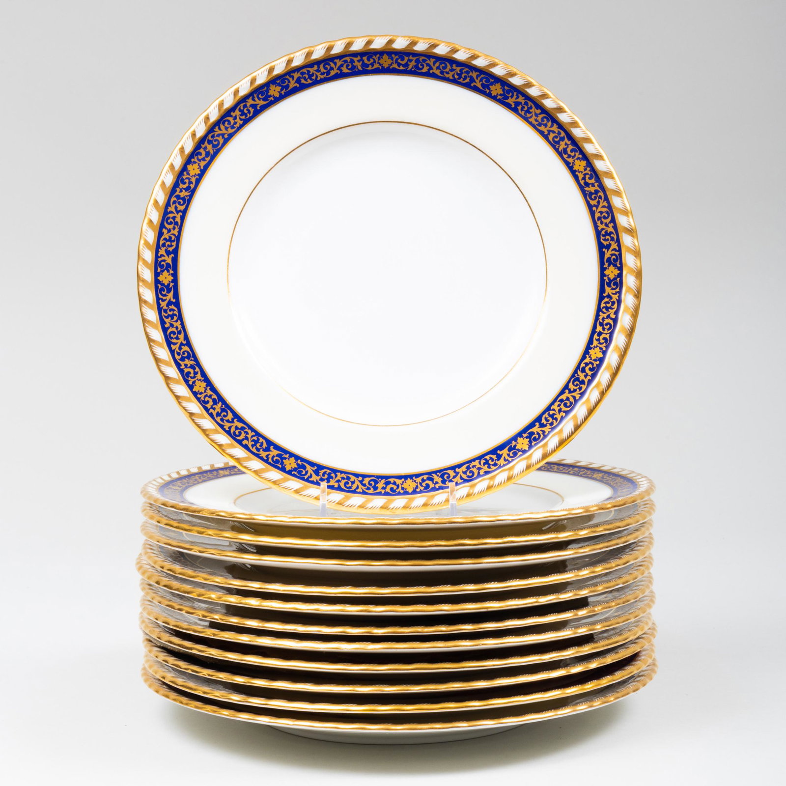 Set of Twelve Minton Blue Ground Porcelain Dinner: Set of Twelve Minton Blue Ground Porcelain Dinner Plates Impressed mark, printed retailer's mark for Tiffany. 10 1/2 in. diam. Property from the Estate of Audrey Zauderer