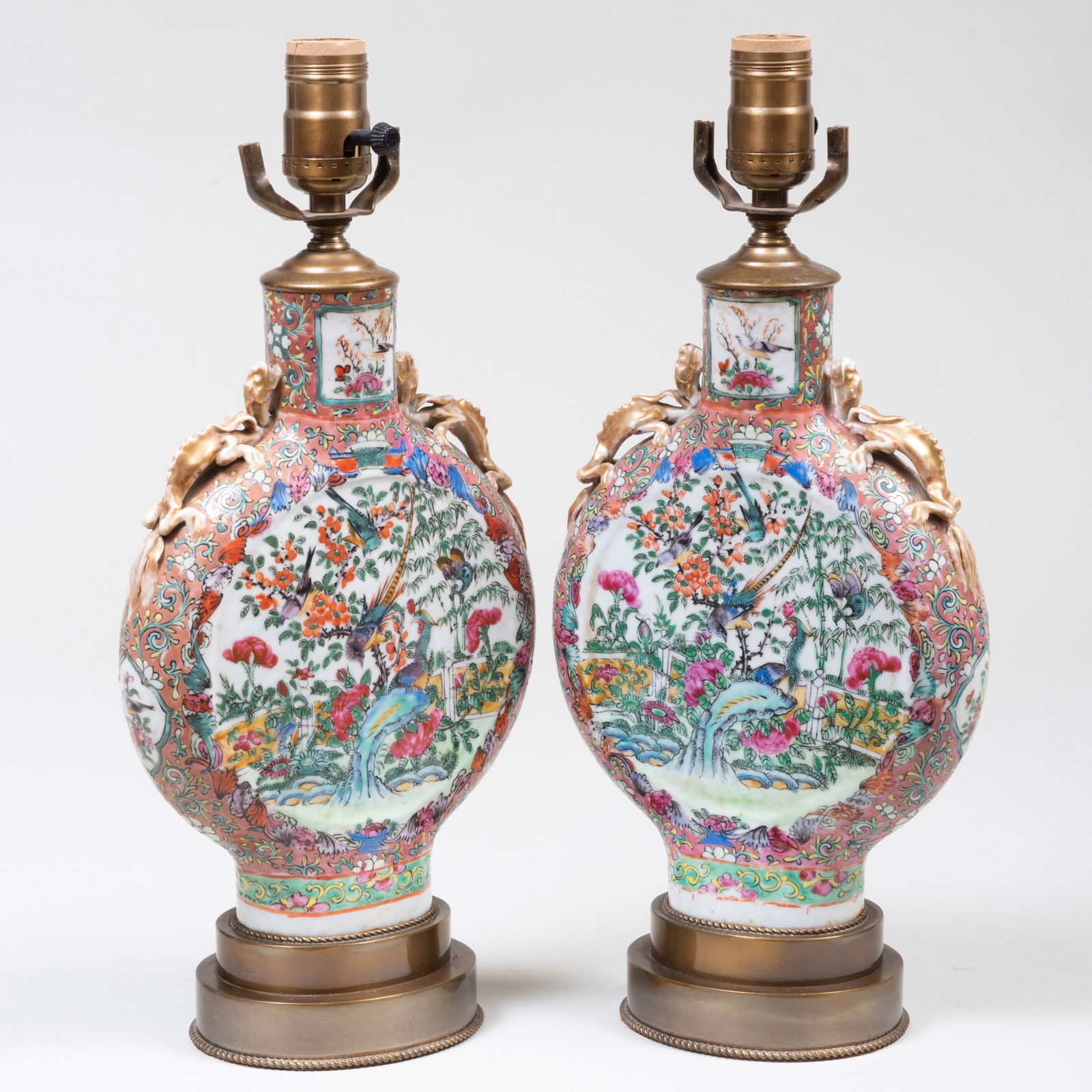 Pair of Chinese Export Pilgrim Flasks Mounted as Lamps: Pair of Chinese Export Pilgrim Flasks Mounted as Lamps 15 3/4 x 7 1/2 x 4 in. (to socket). Property from the Estate of Nancy Moreland Bomonti