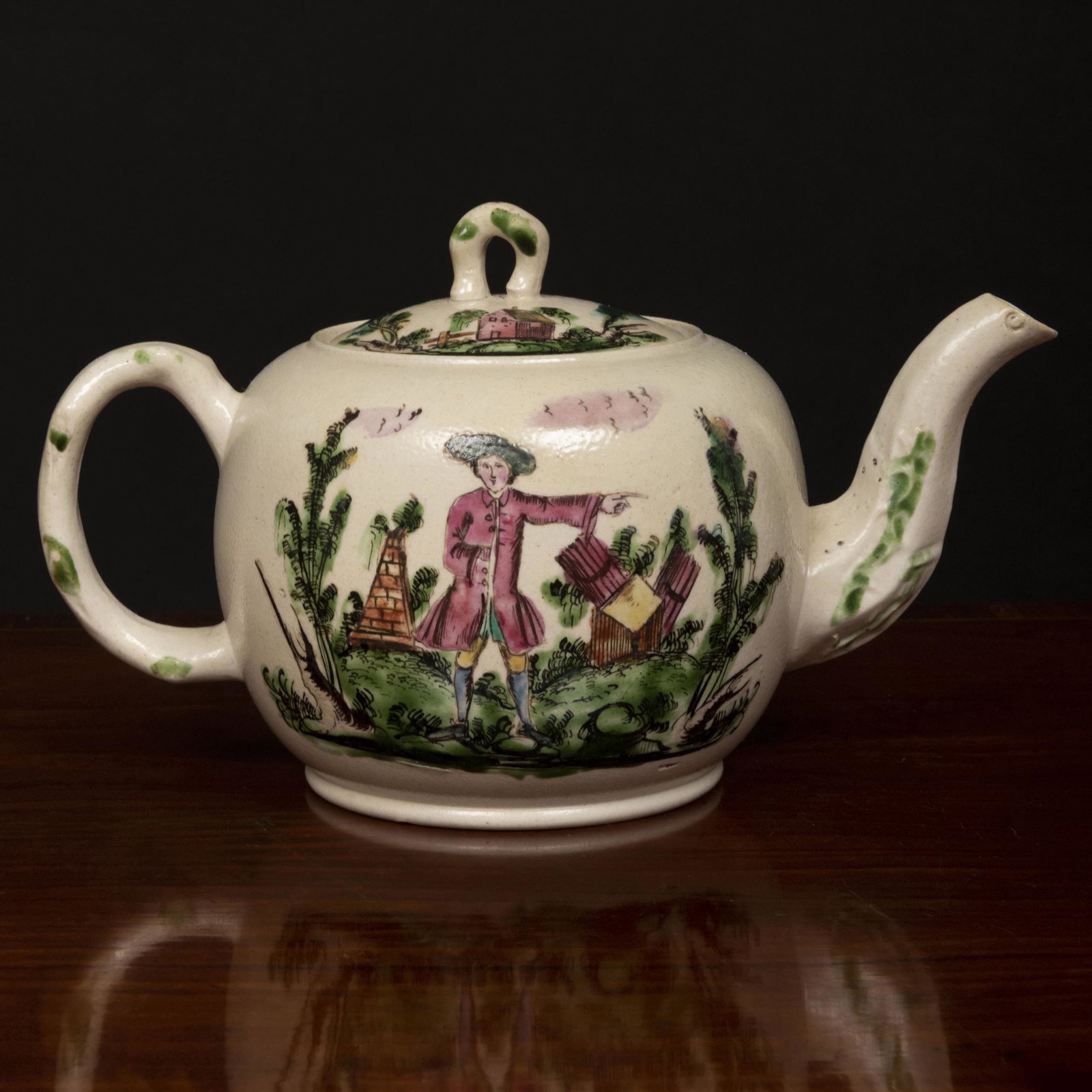 Staffordshire Salt Glazed Earthenware Enameled Teapot: Staffordshire Salt Glazed Earthenware Enameled Teapot and Cover Unmarked. 4 1/2 x 7 1/4 x 4 in. Property from the Collection of Wynn A. and Elizabeth F. Sayman
