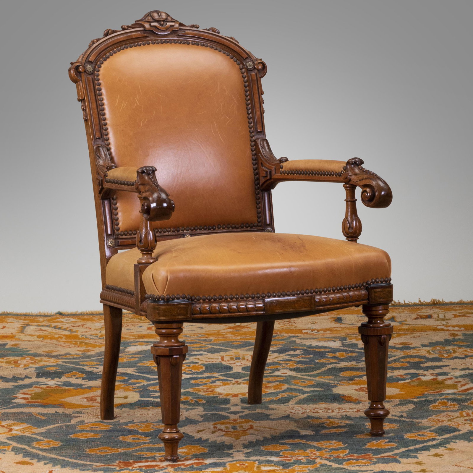 Renaissance Revival Walnut Inlaid Burlwood and: Renaissance Revival Walnut Inlaid Burlwood and Metal-Mounted Armchair Upholstered in leather, and fitted with gilt-metal mounts. 40 1/4 x 24 1/2 x 23 in., height of seat 17 in. Old World New Yor