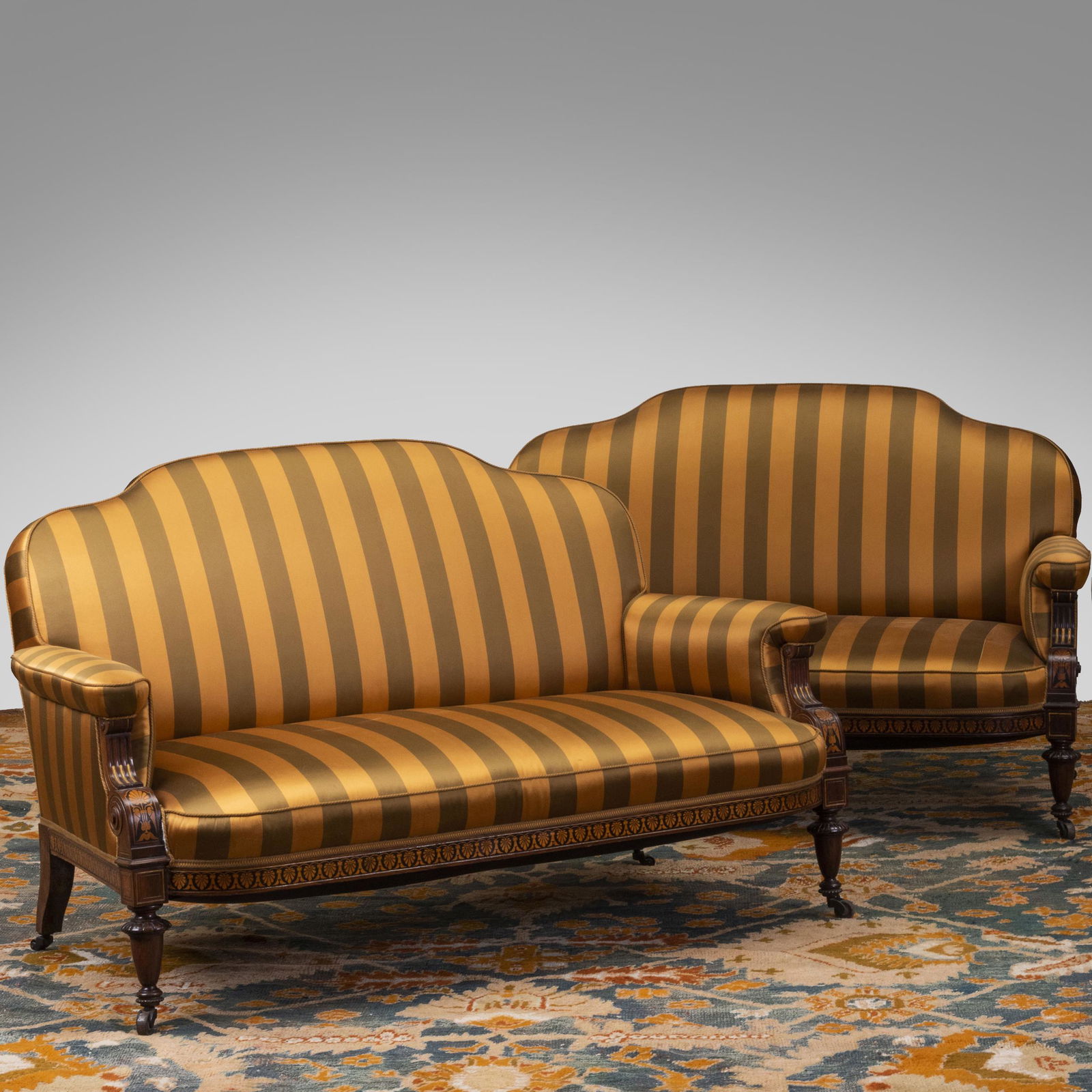 Pair of Renaissance Revival Rosewood and Various Woods: Pair of Renaissance Revival Rosewood and Various Woods Marquetry and Parcel-Gilt Settees, Attributed to Herter Brothers Upholstered in silk striped fabric. 34 x 4 ft. 9 1/2 in. x 32 in., height of sea