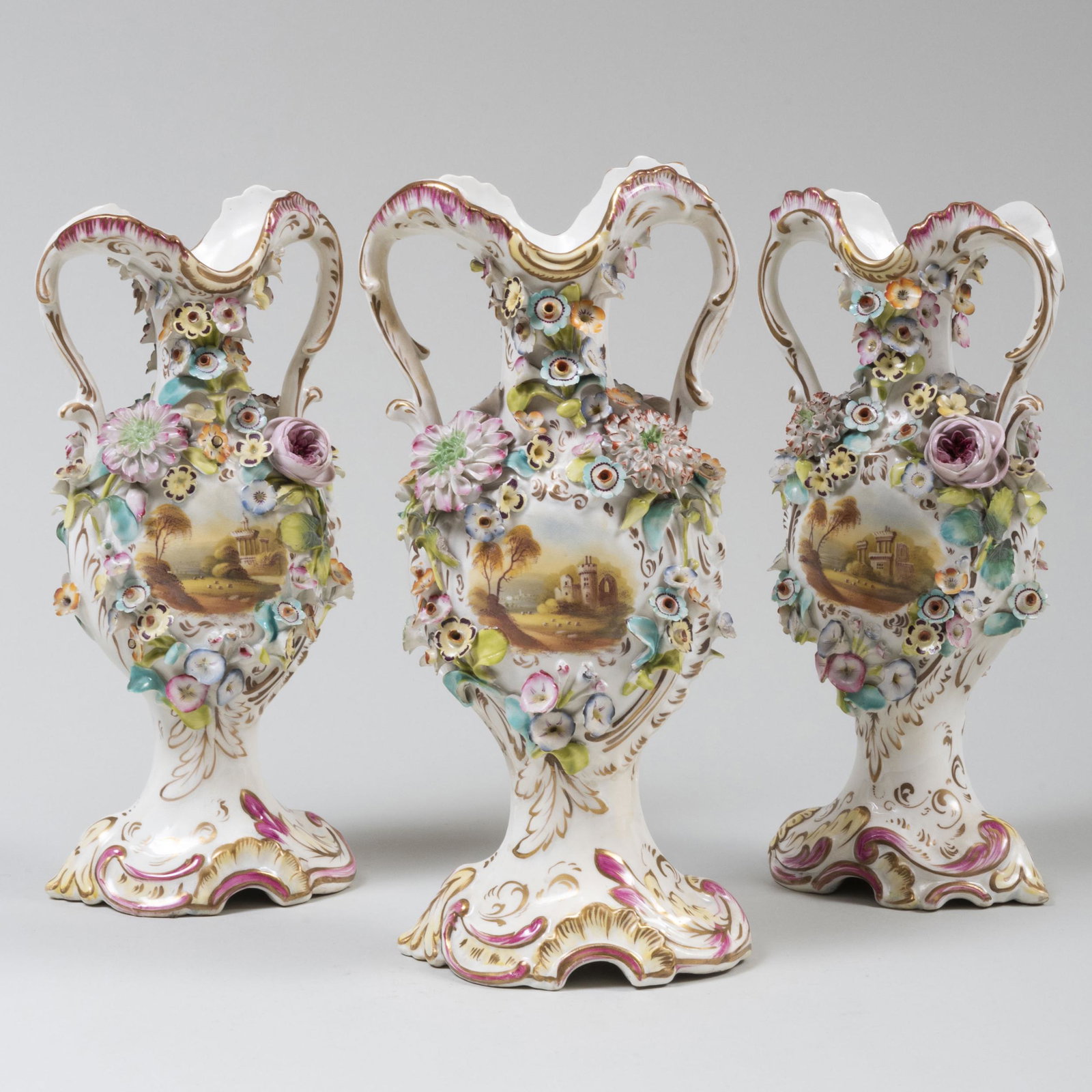 Three Piece English Flower Encrusted Porcelain: Three Piece English Flower Encrusted Porcelain Garniture Unmarked. The larger 11 3/4 x 5 1/4 x 3 1/2 in. Estate of Don F. Gaston, Greenwich, Connecticut