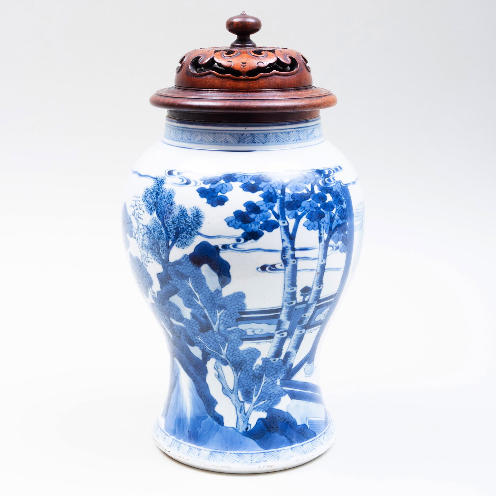 Chinese Blue and White Porcelain Baluster Vase: Chinese Blue and White Porcelain Baluster Vase Unmarked; together with a wood cover. The vase 10 1/2 x 7 1/2 in. diam., 13 x 7 1/2 in. diam. (overall). The Collection of Dr. Daniel and Myrna Clyman