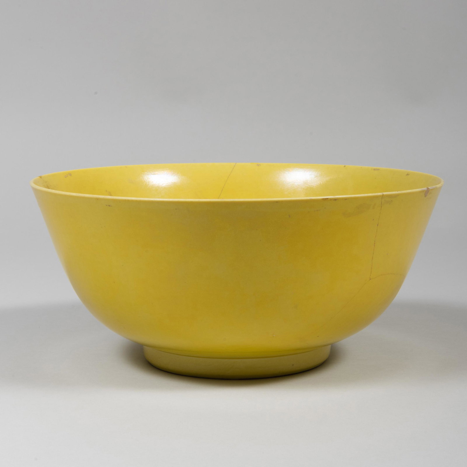 Chinese Yellow Glazed Porcelain Bowl: Chinese Yellow Glazed Porcelain Bowl Unmarked. 5 1/2 x 12 in. diam. Property from the Estate of Nanette Ross