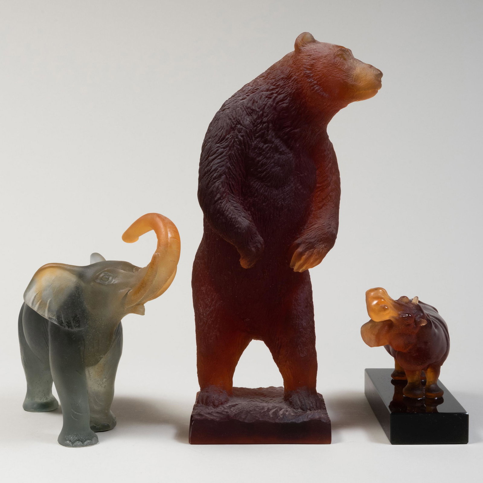 Group of Three Daum Pâte de Verre Models of: Group of Three Daum Pâte de Verre Models of Animals Signed in etch. Comprising: A grizzly bear, numbered '48/1000' An elephant A hippo The largest 13 3/4 x 5 x 5 in. Property from an Important Es