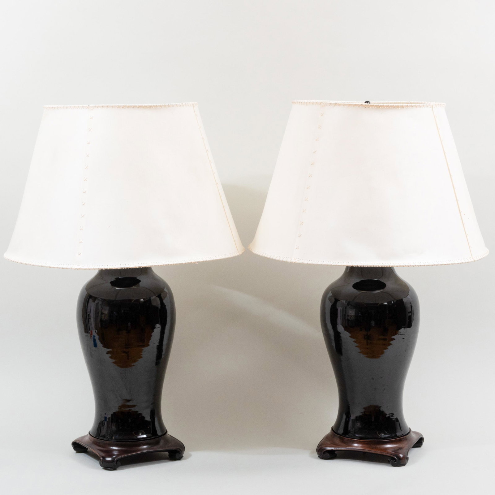 Pair of Chinese Black Glazed Vases Mounted as Lamps, with Hand Made Shades by Michael Taylor: Pair of Chinese Black Glazed Vases Mounted as Lamps, with Hand Made Shades by Michael Taylor The vases 21 x 9 in. diam., 33 1/2 x 22 in. diam. (overall with shade). Masterfully Decorated Homes: Proper