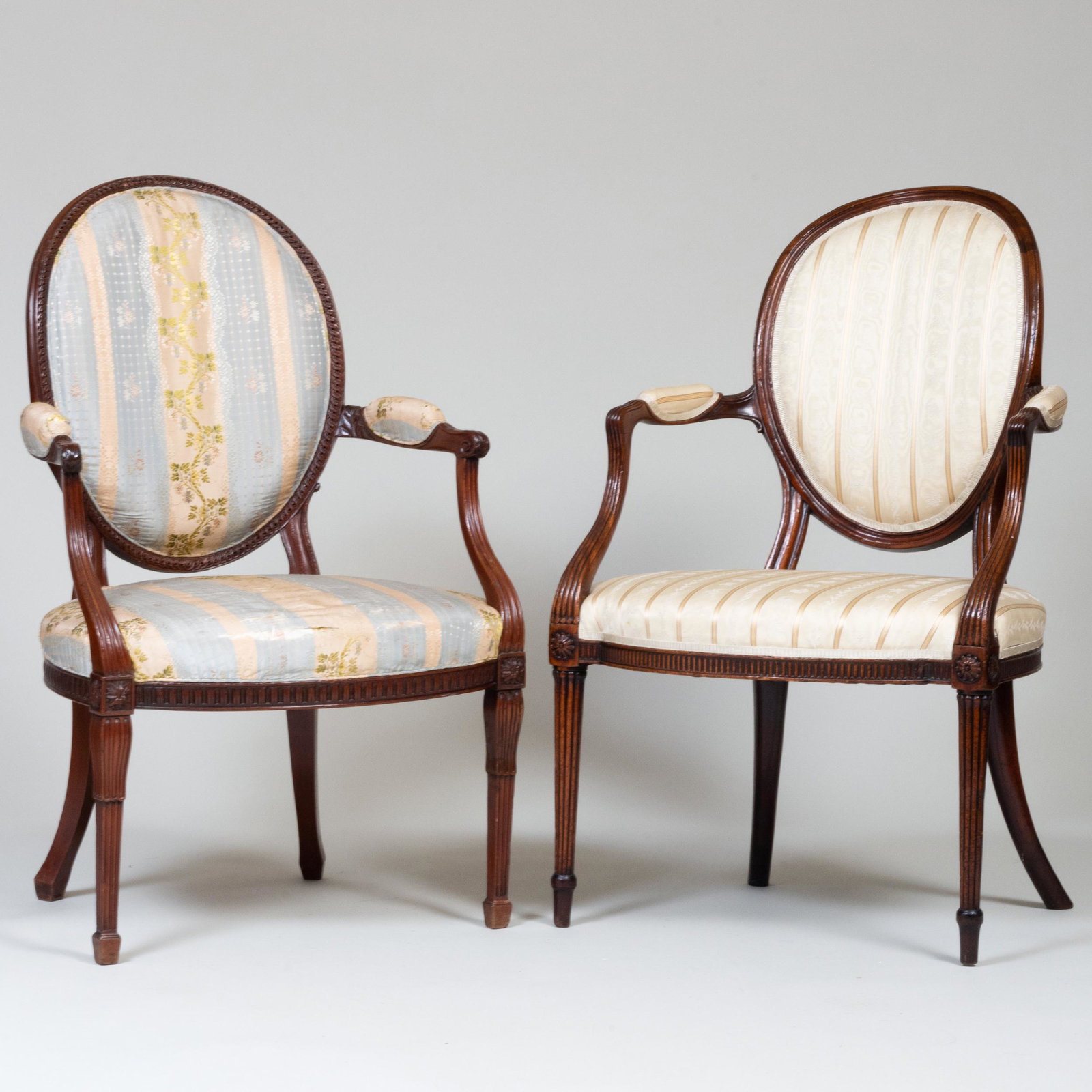 Two George III Carved Mahogany Armchairs, One Stamped B. Harmer: Two George III Carved Mahogany Armchairs, One Stamped B. Harmer The larger 37 3/4 x 23 1/4 x 20 1/2 in., height of seat 16 1/2 in. Stamped B. Harmer. Note: Very little is known about this talented cab