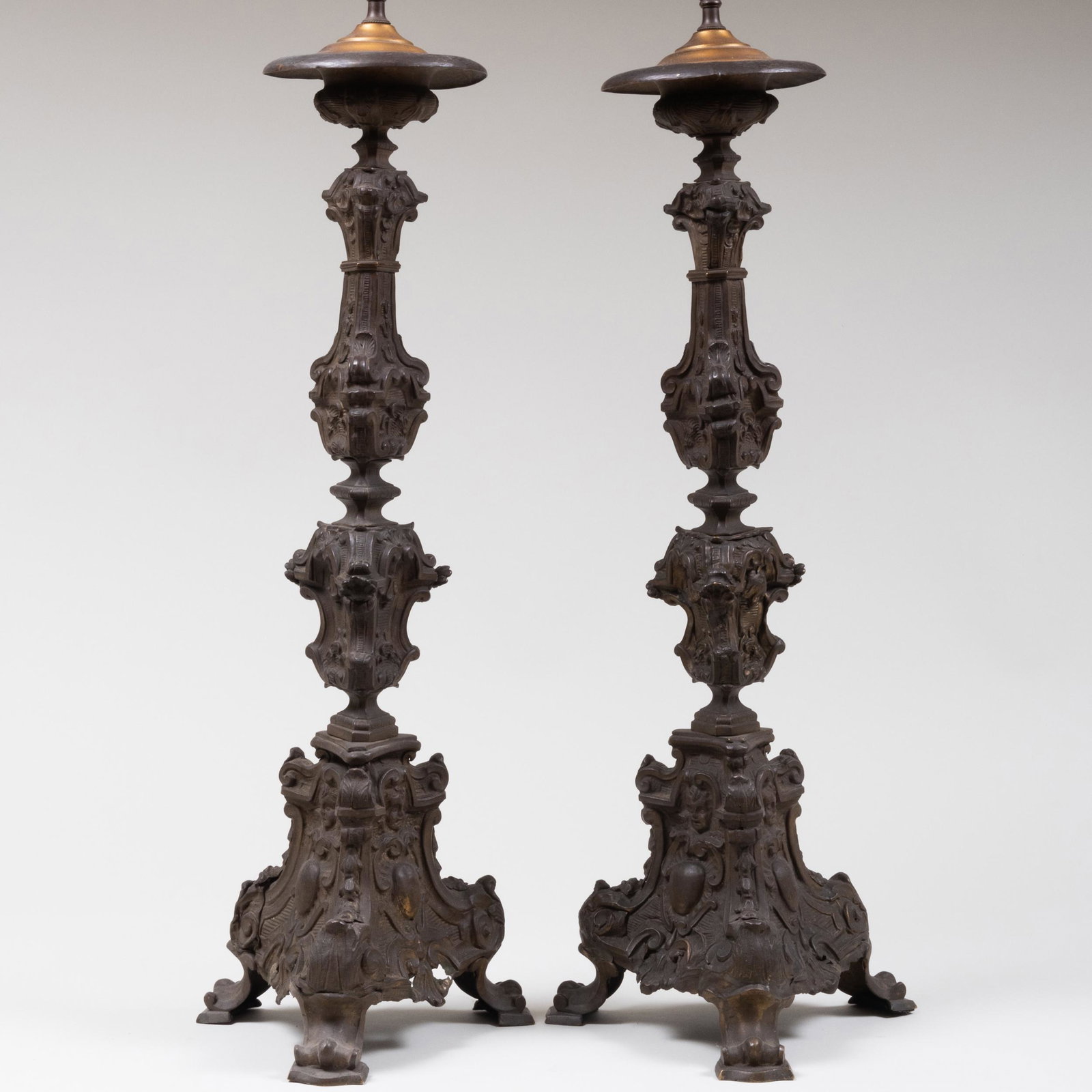 Renaissance Style Wrought Iron Pricket Sticks: Renaissance Style Wrought Iron Pricket Sticks A cartouche on each inscribed: 'SS TO SAG'. Formerly wired for electricity. 39 1/2 x 10 x 8 in. Skinner, Boston, MA, January 10, 2009, Lot 696. Prop
