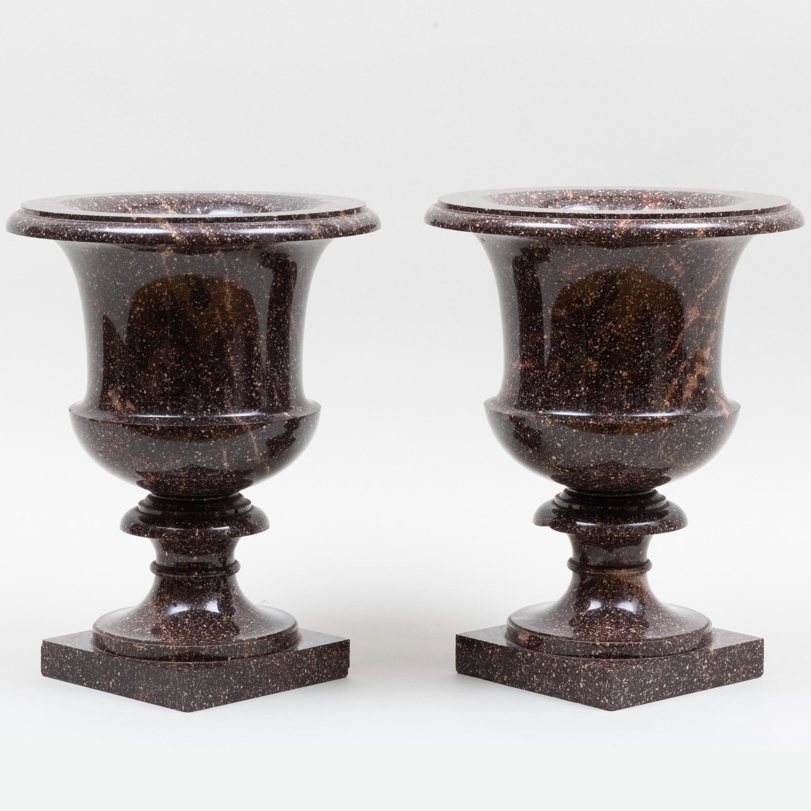 Pair of Fine Swedish Neoclassical Porphyry Urns, the Model Designed by Louis Masreliez: Pair of Fine Swedish Neoclassical Porphyry Urns, the Model Designed by Louis Masreliez 15 3/4 x 12 in. diam. Note: Swedish porphyry is a rare material which is predominately quarried in Alvadalen, Swe