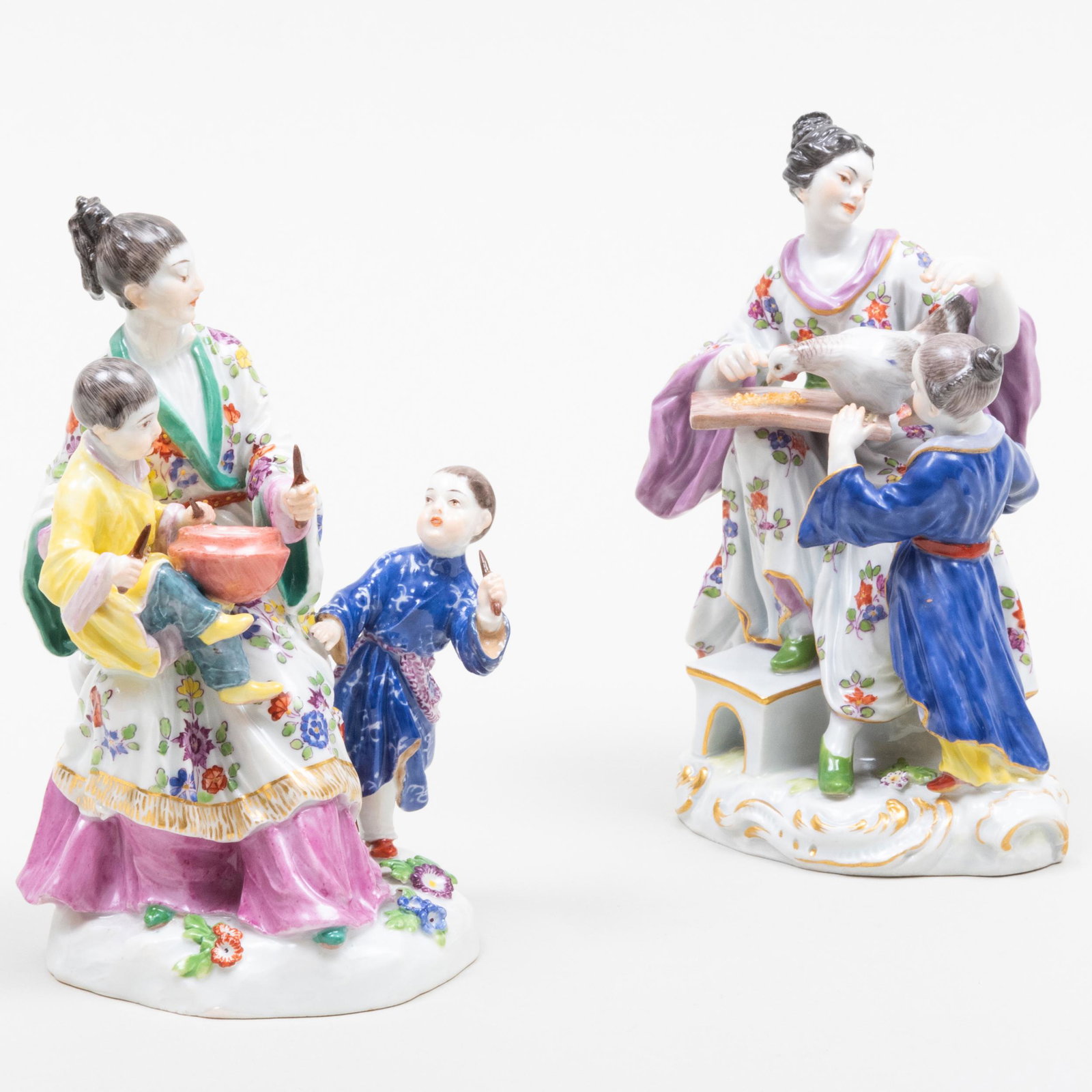 Two Meissen Porcelain Chinoiserie Figural Groups: Two Meissen Porcelain Chinoiserie Figural Groups Comprising: A figure of a woman with two boys, blue crossed swords mark A figure of a woman with child and chicken, blue crossed swords and jubilee mar