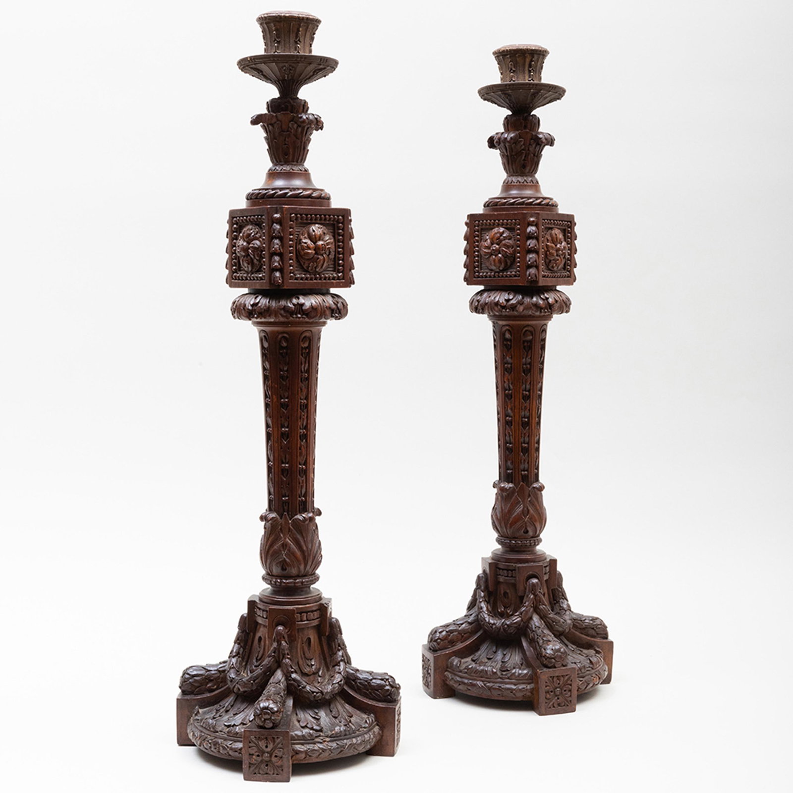 Pair of Tall Continental Carved Mahogany Candlesticks, Possibly French: Pair of Tall Continental Carved Mahogany Candlesticks, Possibly French 26 x 8 in. diam. Property from a Kent, CT Collector