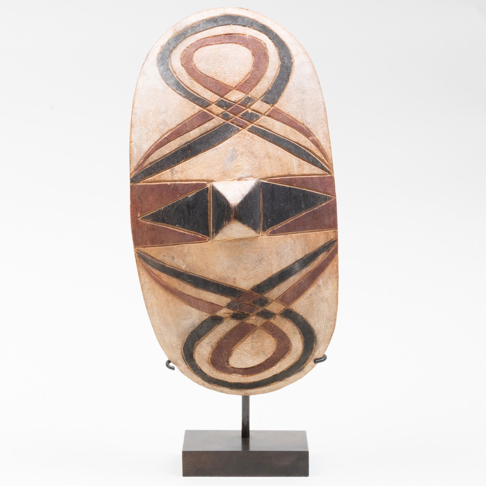 Tutsi Shield, rwanda: Tutsi Shield, rwanda Wood, red, black and white pigments. The shield 12 in.; 14 x 6 x 3 in. (overall). Bonhams, NY, Nov. 11, 2010, Lot 6311. Property from the Estate of Maurice Solomon