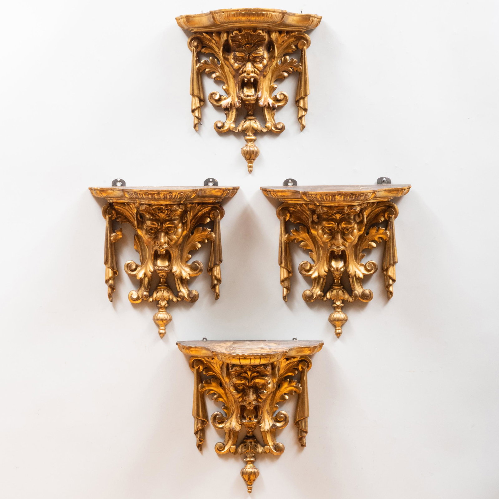 Set of Four Continental Baroque Style Carved Giltwood Brackets with Masks: Set of Four Continental Baroque Style Carved Giltwood Brackets with Masks 14 x 13 1/2 x 8 1/2 in. Property from a Kent, CT Collector
