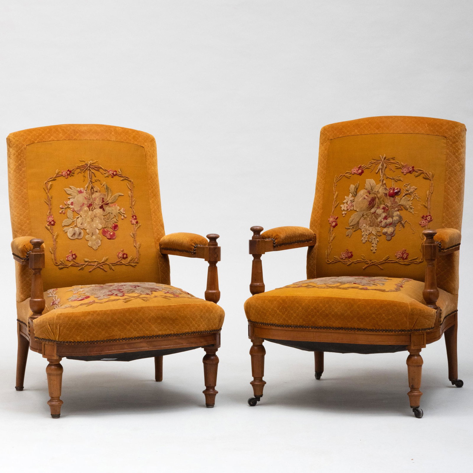Pair of Continental Walnut Upholstered Armchairs: Pair of Continental Walnut Upholstered Armchairs Each with appliquéd and velvet upholstery. 39 1/2 x 27 x 24 1/2 in., height of seat 17 in. 