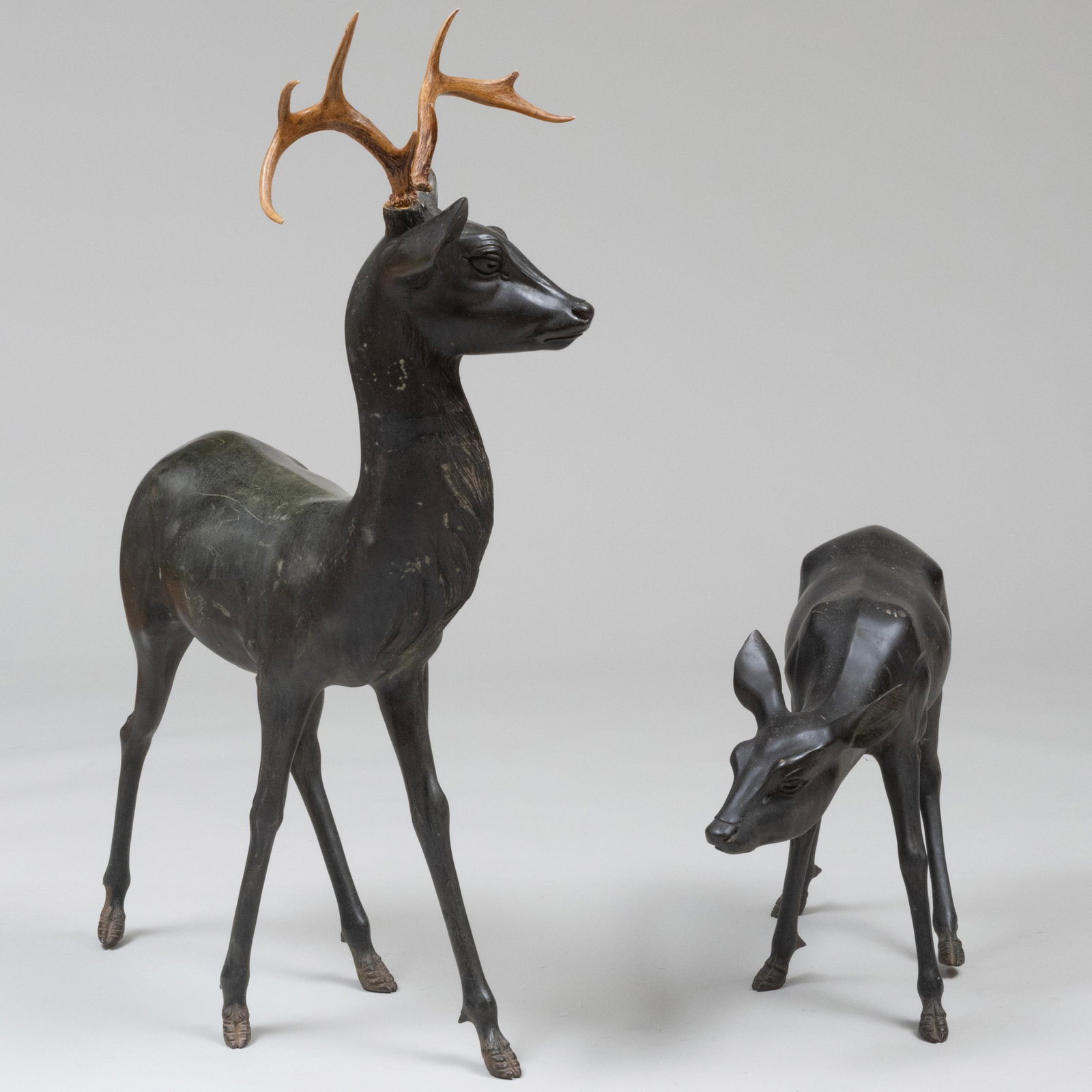 Two Bronze Models of Deer: Two Bronze Models of Deer One with antlers. The taller 46 x 34 x 17 3/4 in.; the smaller deer 20 x 7 1/2 x 32 1/4 in. Property from a Kent, CT Collector