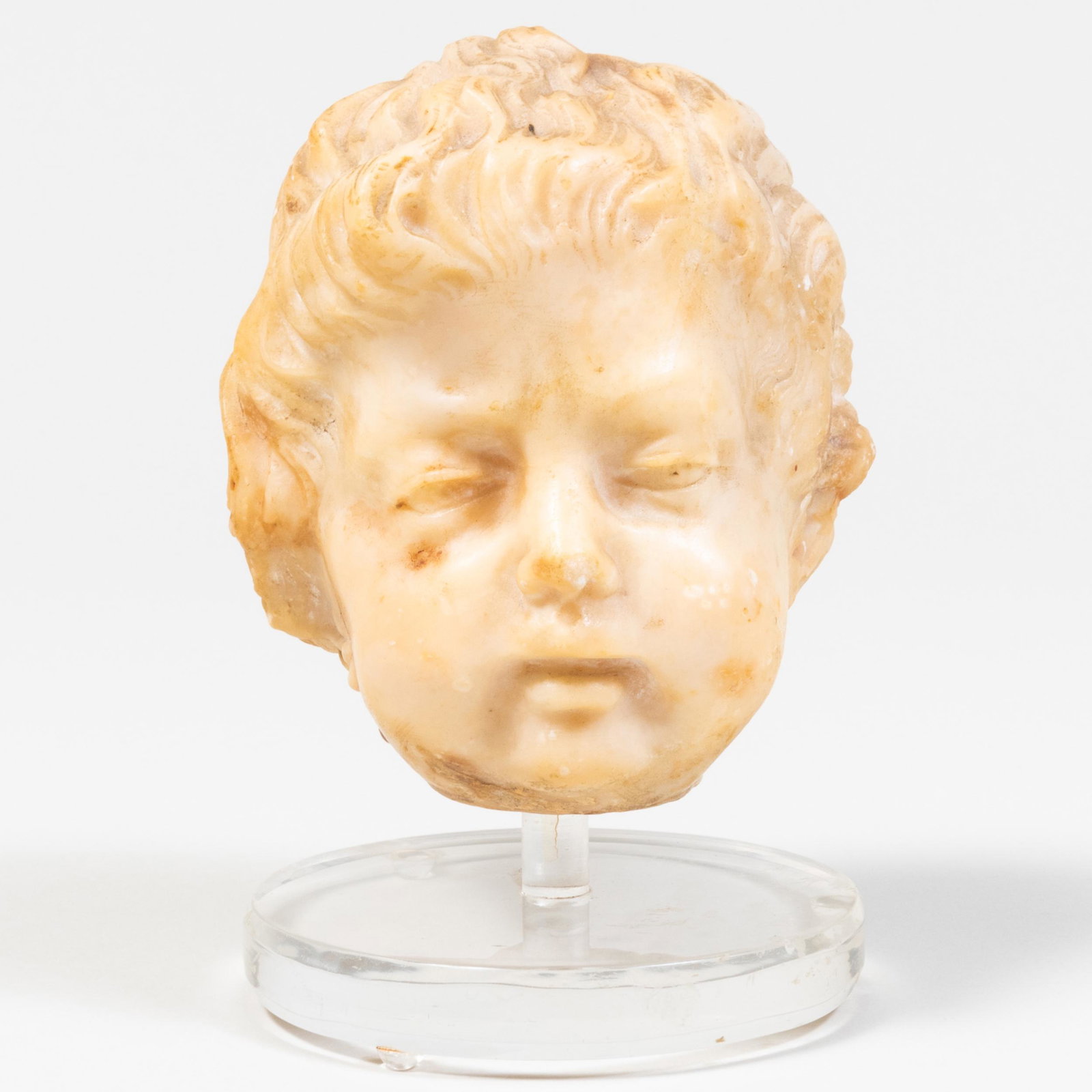Continental Baroque Carved White Marble Bust of a Cherub: Continental Baroque Carved White Marble Bust of a Cherub 4 1/8 x 3 1/2 x 3 1/2 in. (the bust); height overall 5 1/8 in. Property from the Estate of Ernest Kafka