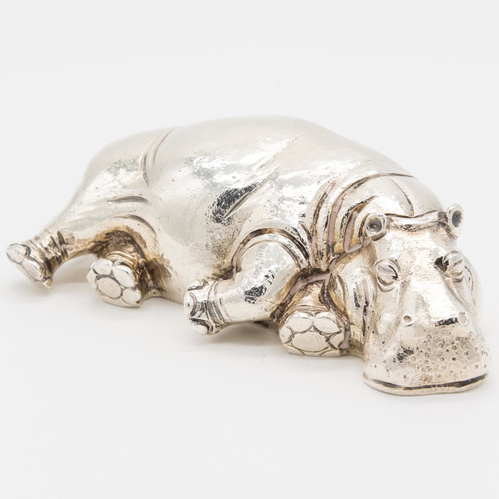 Asprey Silver Figure of a Reclining Hippo: Asprey Silver Figure of a Reclining Hippo Marked London, 1996. 4 in. long, 7.6 oz. approx. weight.