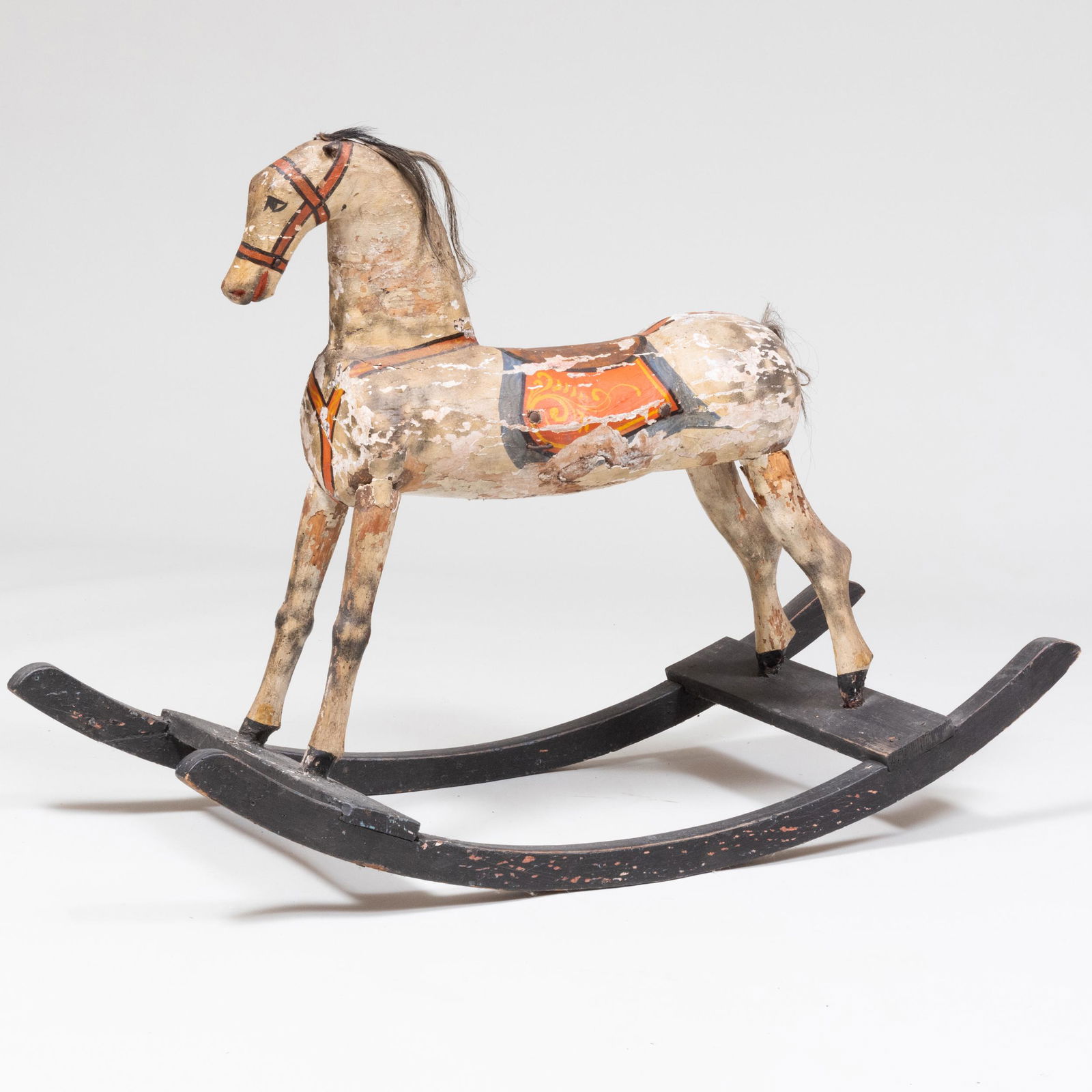 American Painted Rocking Horse: American Painted Rocking Horse With horsehair main and tail and leather ears.