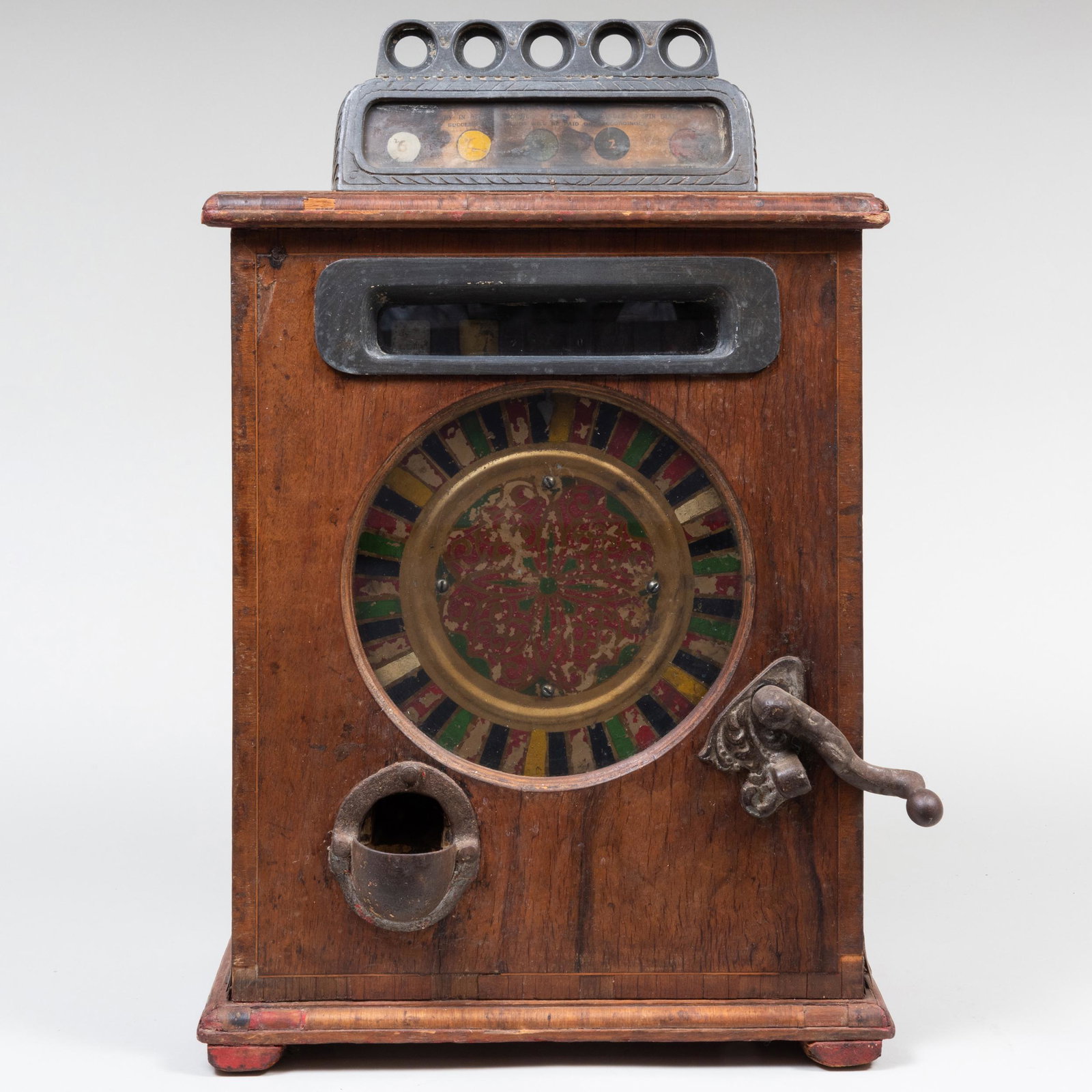 Edwardian Oak and Metal Gambling Machine: Edwardian Oak and Metal Gambling Machine With Painted Face and Metal Crank. 25 1/4 x 16 1/4 x 9 3/4 in.