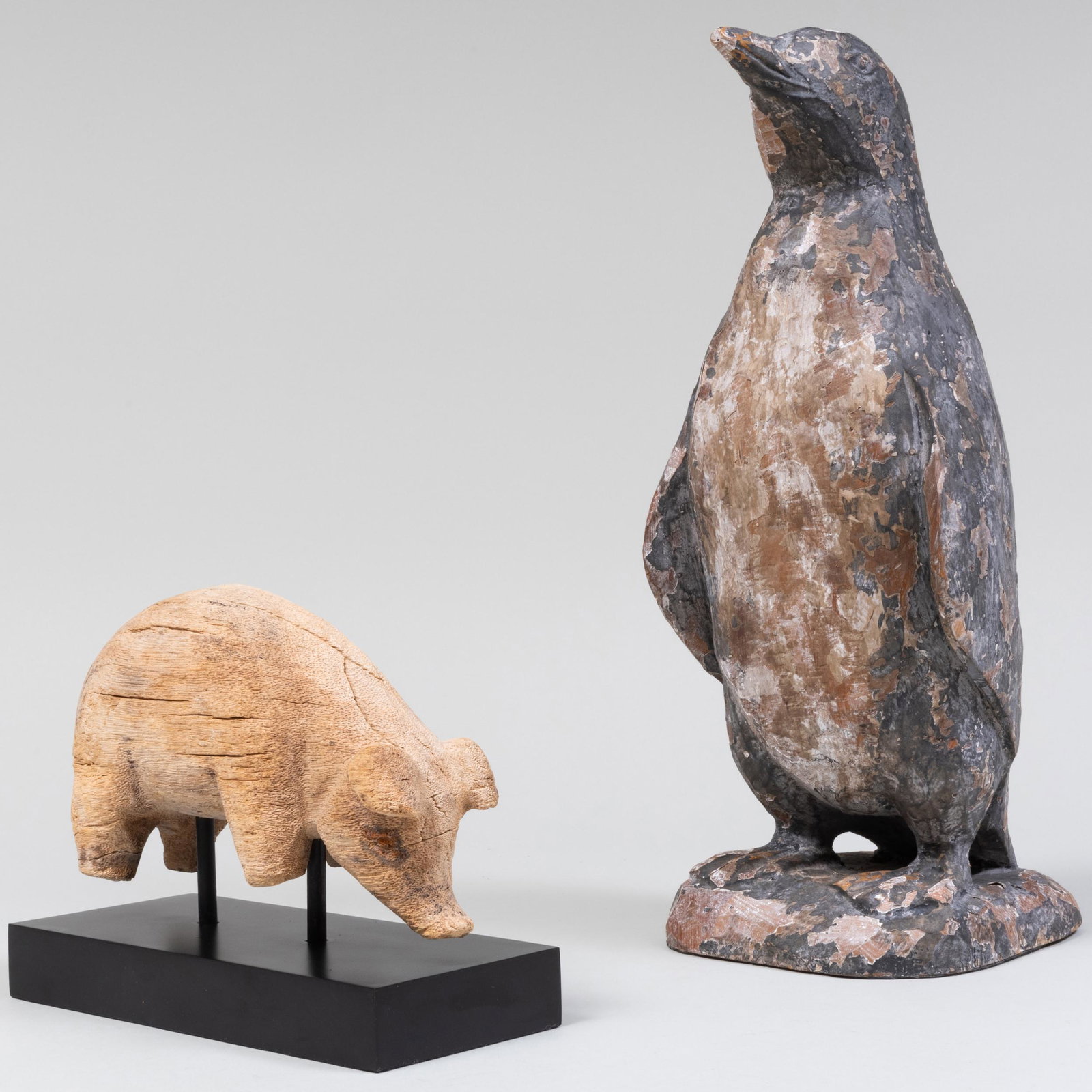 Wood Folk Art Figures of a Penguin and Pig: Wood Folk Art Figures of a Penguin and Pig The pig raised on stand. The penguin 17 x 7 x 6 in. Property from the Collection of Susan Lasker Brody