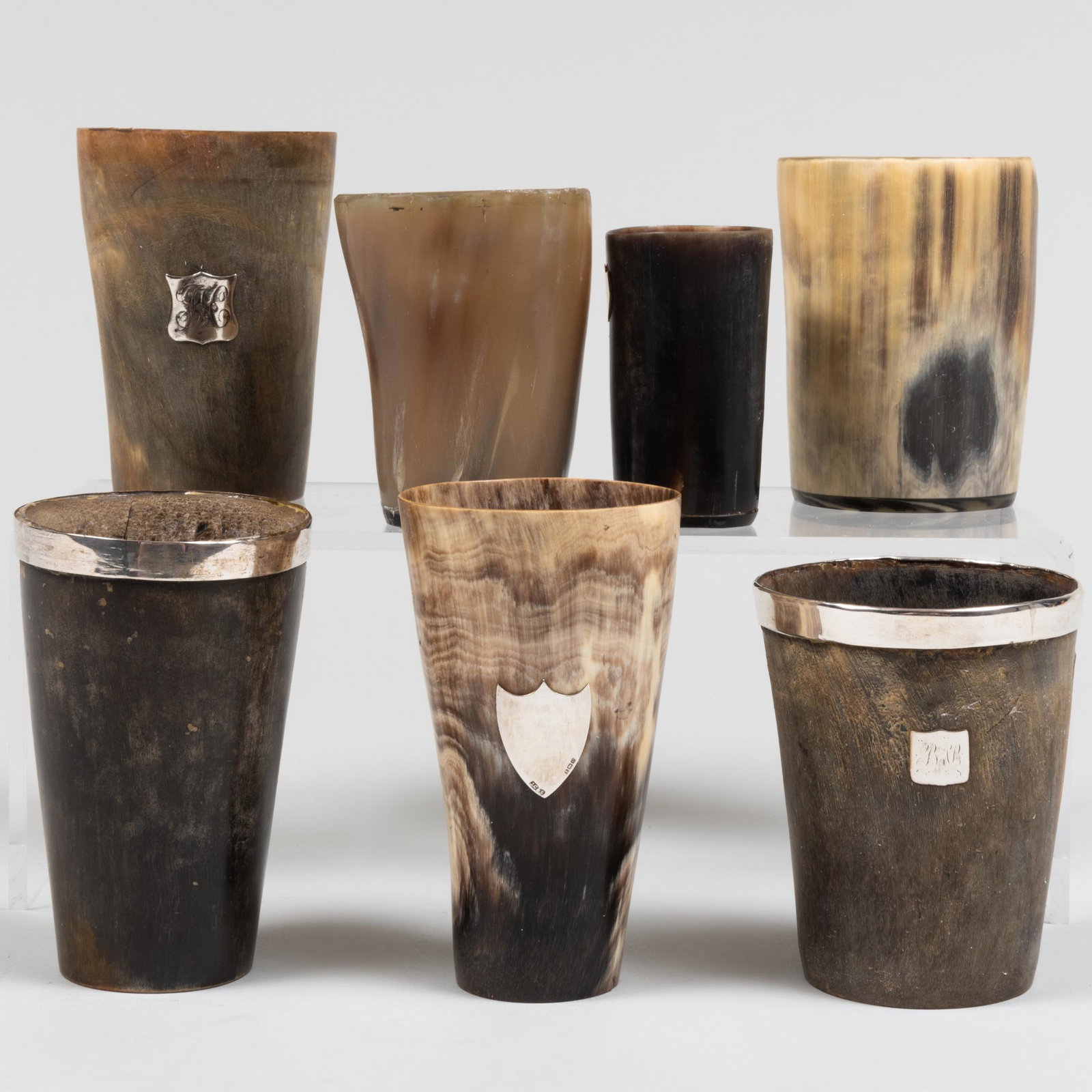 Group of Seven Silver-Mounted and Horn Cups: Group of Seven Silver-Mounted and Horn Cups The silver unmarked. Comprising: Two beakers with mounts and badges Three with badges Two without mounts The largest 4 1/2 x 2 3/4 in. diam. Pro