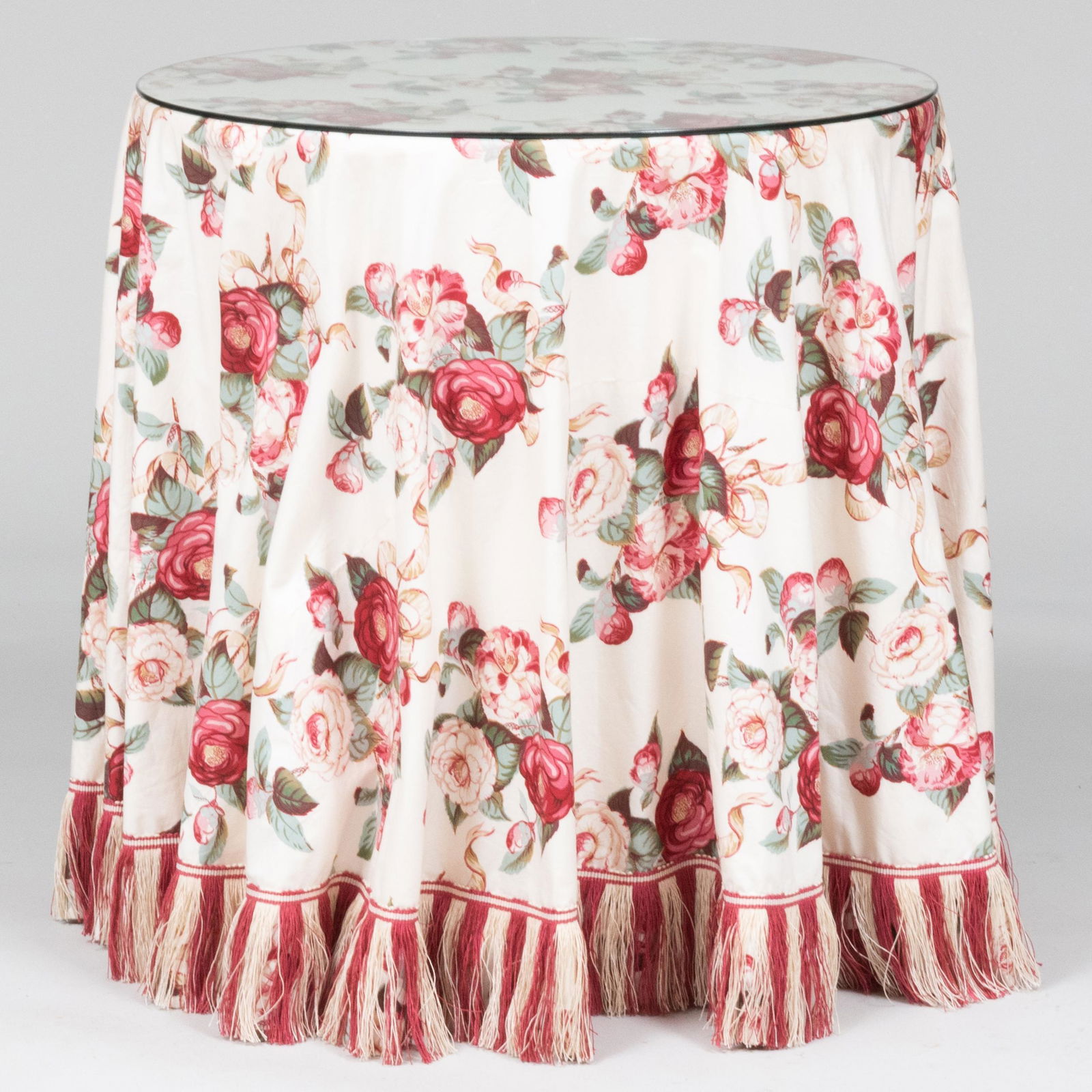 Two Contemporary Circular Tables Draped with Red and Rose Printed Chintz Fabric (1 of 9)