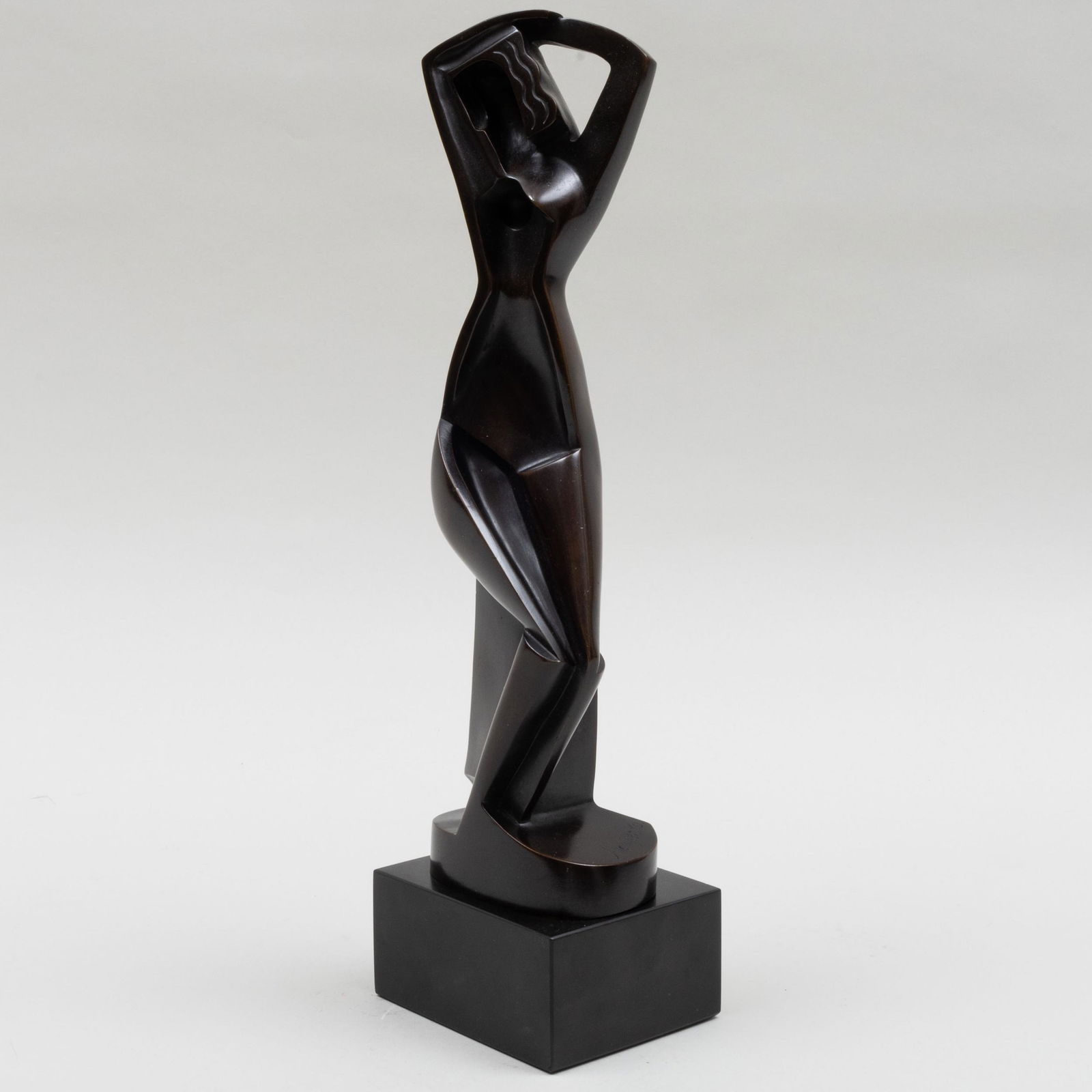 After Alexander Archipenko (1887-1964): Femme assise se coiffant: After Alexander Archipenko (1887-1964): Femme assise se coiffant Bronze, inscribed 'Archipenko' at bottom, with the Guss Heinz-Barth foundry mark, black slate stand. 13 1/2 in. (height). Note: T
