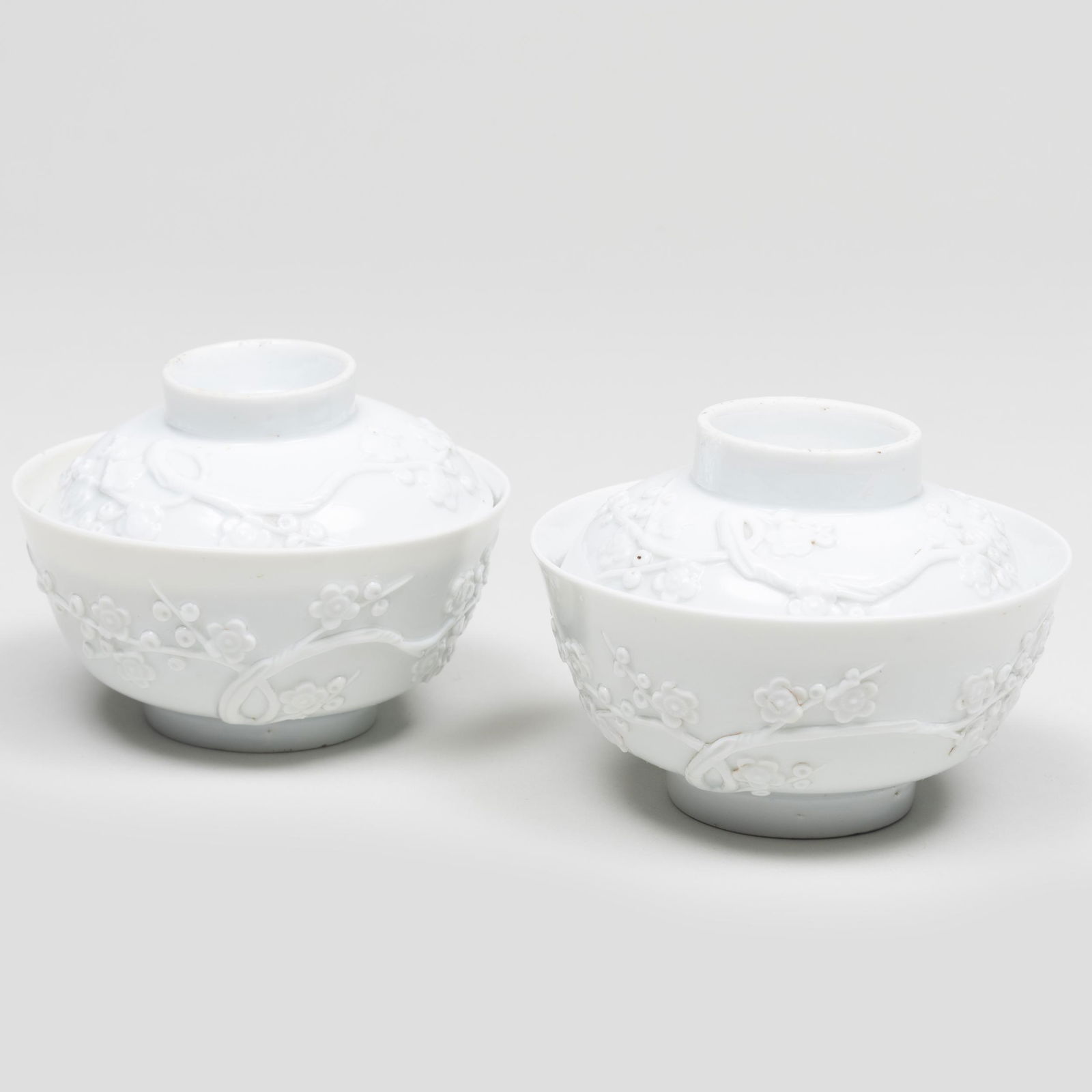 Pair Chinese of White Glazed Bowls and Covers with Molded Prunus Blossoms (1 of 7)