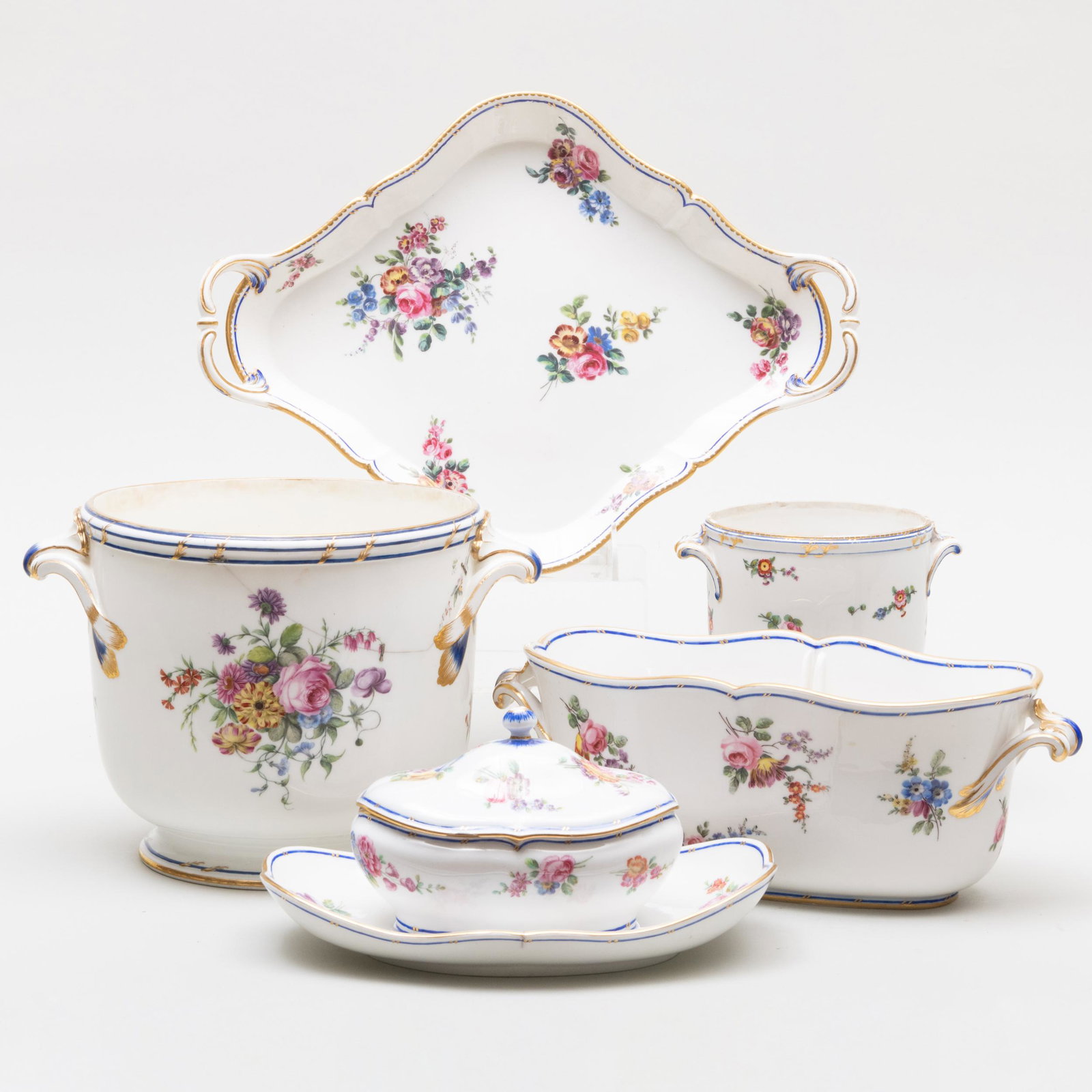 Group of Sevres Cobalt and Flower Decorated Porcelain Serving Pieces: Group of Sevres Cobalt and Flower Decorated Porcelain Serving Pieces Various interlaced 'L' marks. Comprising: A bottle cooler A glass rinser A double bottle cooler A sauce tureen and cover on fixed s