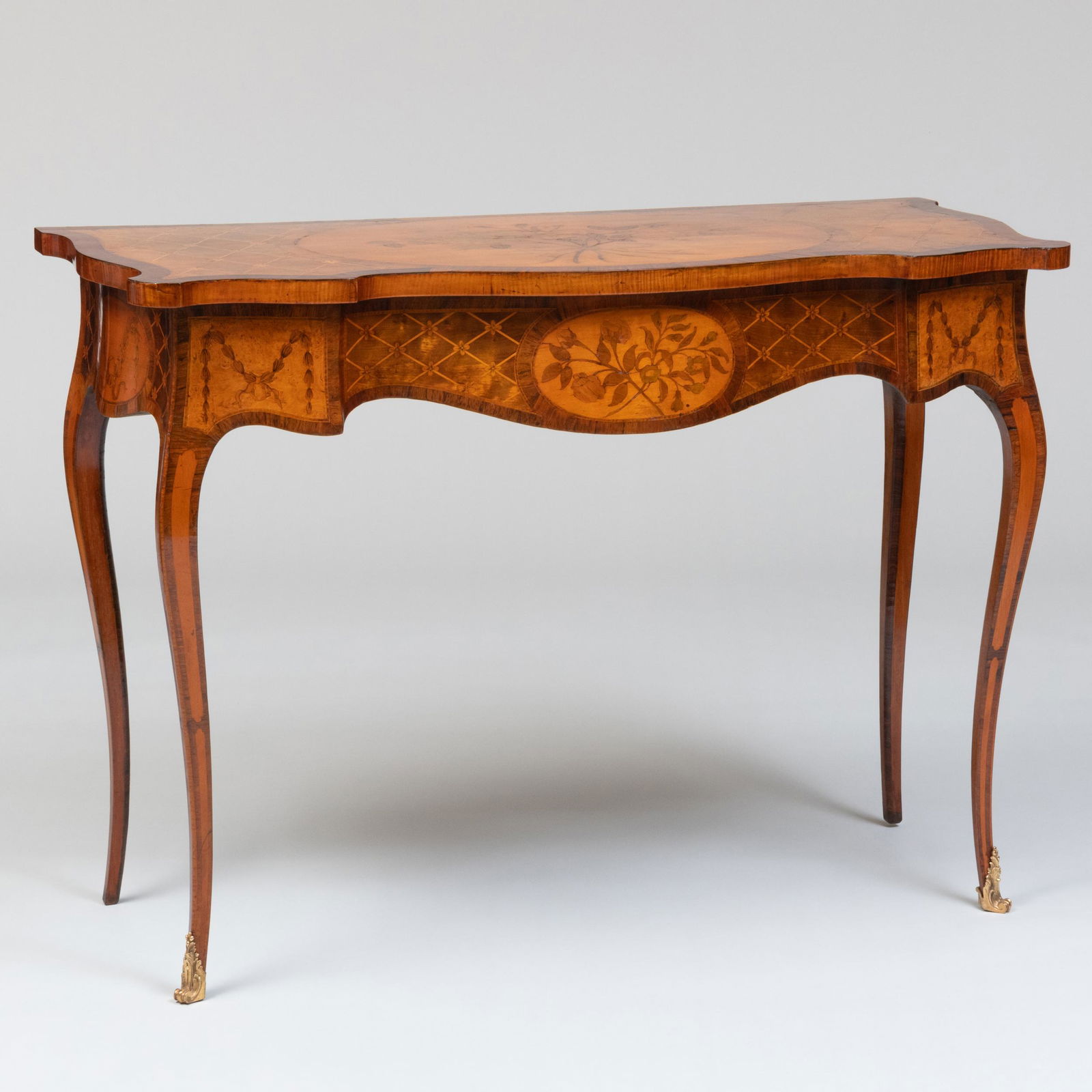 Fine George III Satinwood and Rosewood Marquetry Serpentine-Front Table, Attributed to John Cobb, in: Fine George III Satinwood and Rosewood Marquetry Serpentine-Front Table, Attributed to John Cobb, in the French Taste 32 1/4 x 45 x 21 1/2 in. Note: John Cobb (1710-1778) was one of England's finest