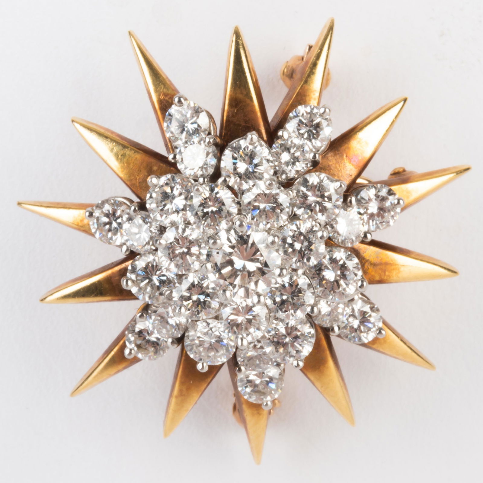 McTeigue 18k Gold, Platinum and Diamond Pendant Brooch: McTeigue 18k Gold, Platinum and Diamond Pendant Brooch Marked, '18k / 14k / PLAT', and with maker's mark 'McT' in oval, set with approx. 30 round dimaonds, weighing approx. 3.00 cts. total. 1 1/4 in.