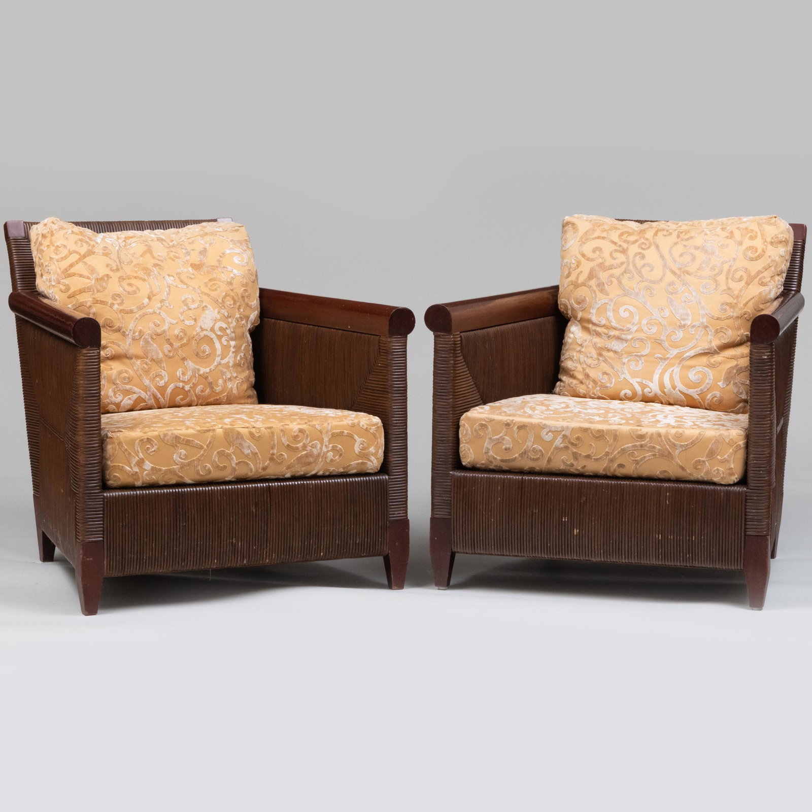 Pair of John Hutton for Donghia Wrapped Rattan Club Chairs: Pair of John Hutton for Donghia Wrapped Rattan Club Chairs Inscribed on the underside: 'DONGHIA'; each with gold cut velvet back and seat cushion. 30 x 30 1/8 x 32 in., seat height 15 in.