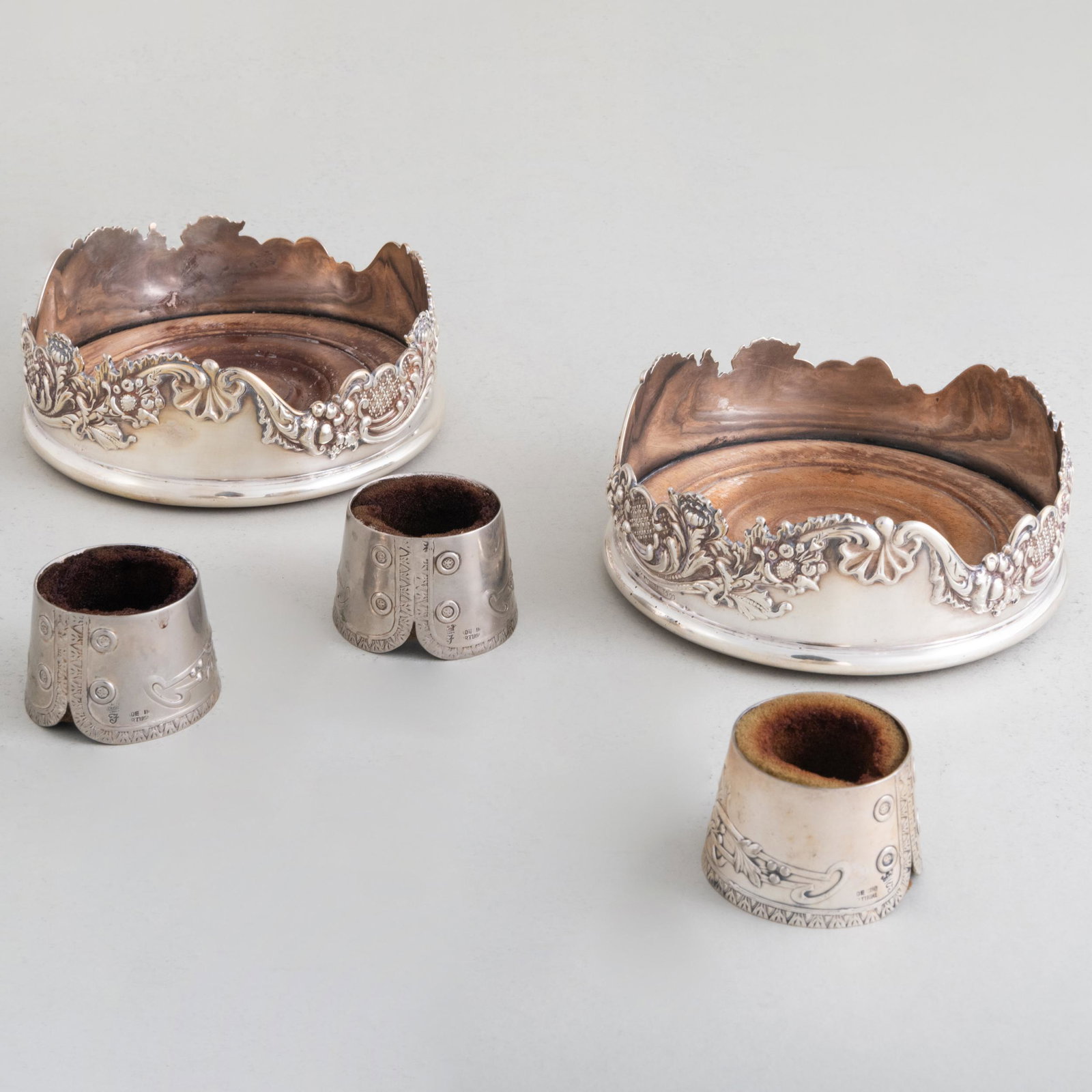 Pair of Silver Plate Bottle Coasters and a Set of Three Portugese Silver 'Cuff' Form Bottle Collars (1 of 9)