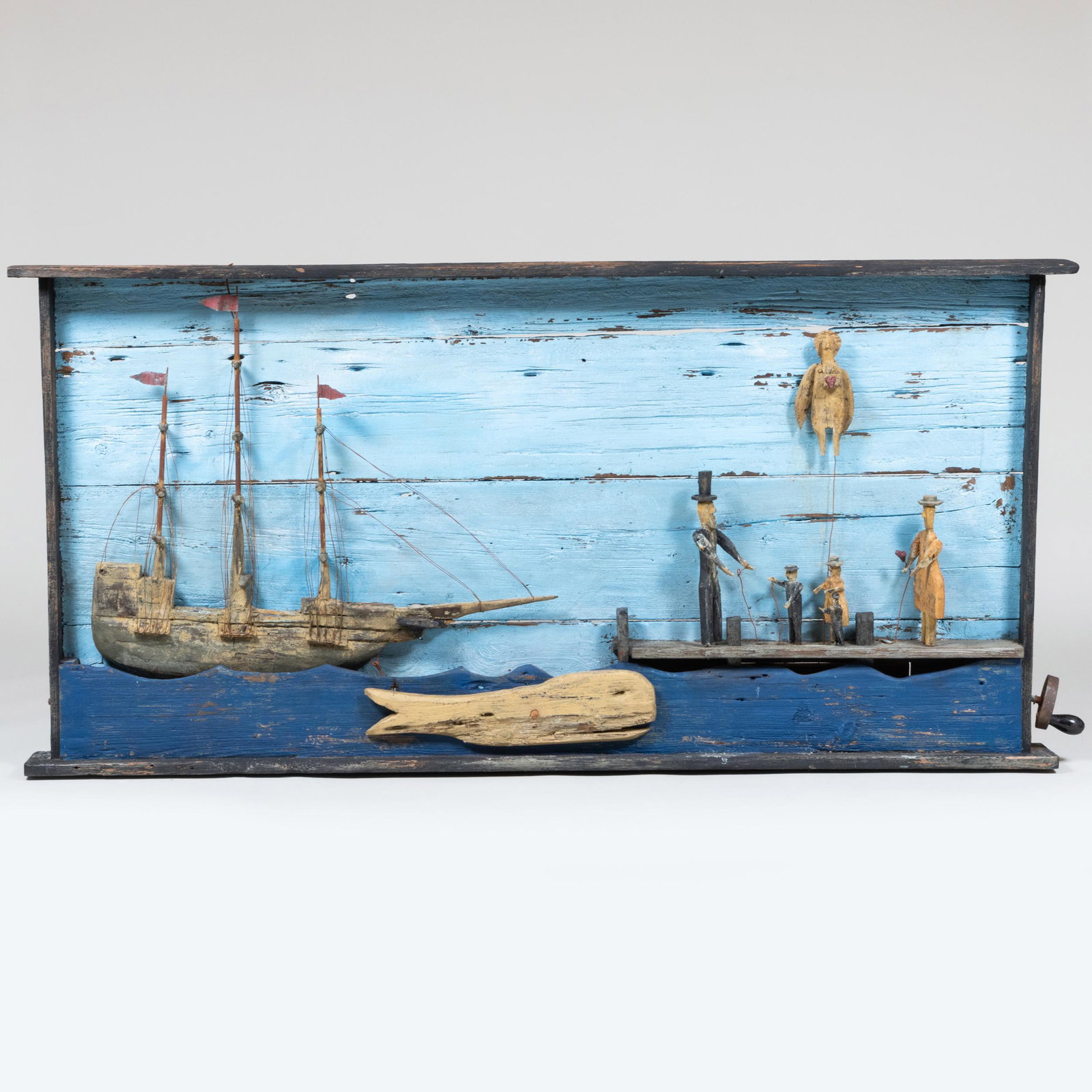 American Naive Carved and Painted Mechanical 'A Heartfelt Goodbye' Whirligig: American Naive Carved and Painted Mechanical 'A Heartfelt Goodbye' Whirligig 37 in. x 6 ft. 5 1/4 in. x 5 1/2 in. Note accompanying this lot from the artist: "For a Captain when it was time to set sai