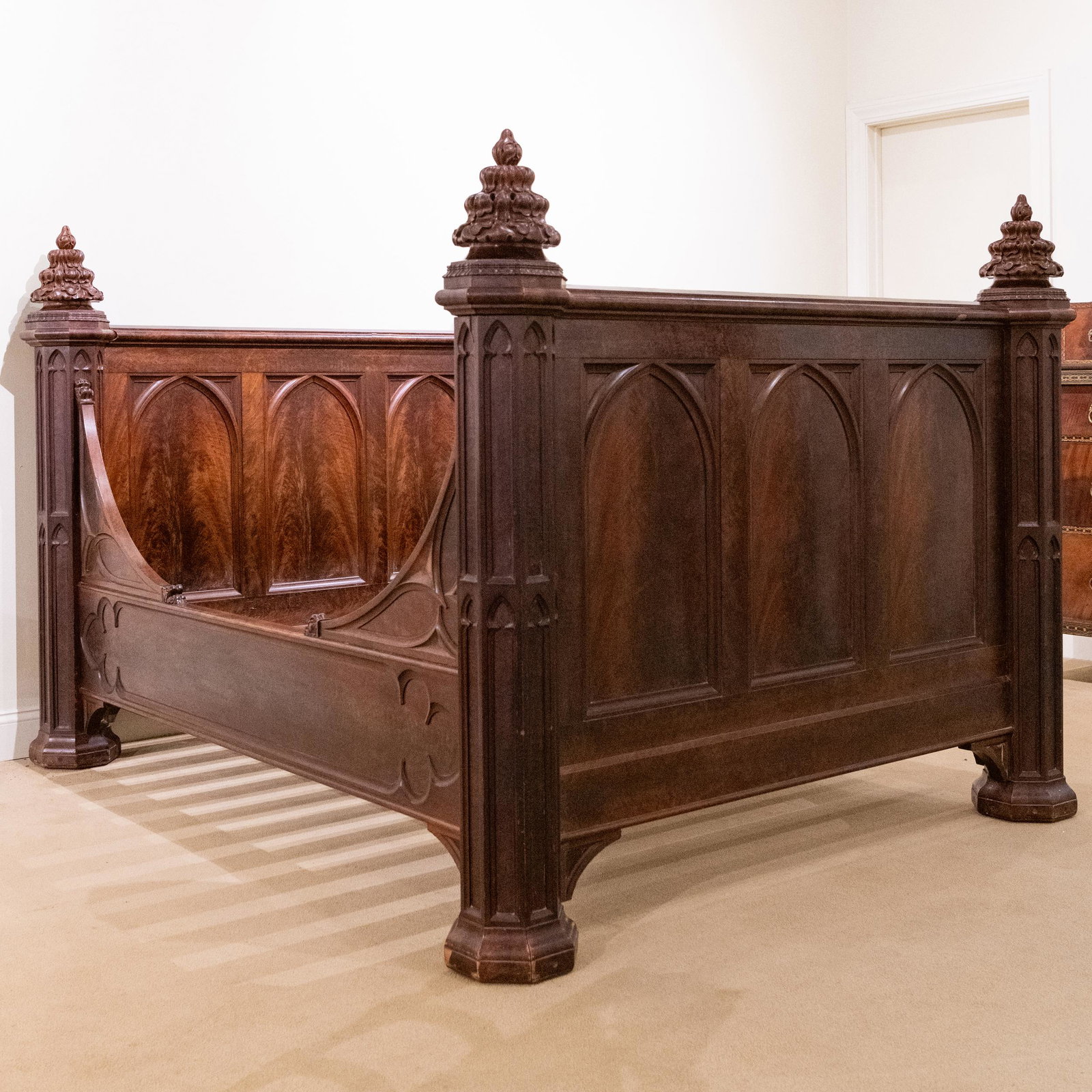 American Gothic Revival Carved Flame Walnut Bedstead, Possibly by Crawford Riddell: American Gothic Revival Carved Flame Walnut Bedstead, Possibly by Crawford Riddell 4 ft. 10 x 5 ft. 10 x 7 ft. 2 in. (overall dimensions). 6 ft. x 4 ft. 11 in. (interior mattress dimensions).