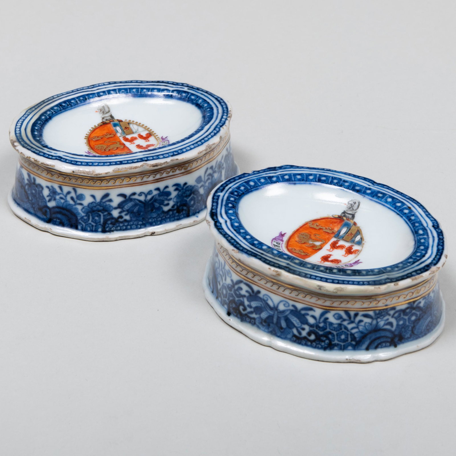 Pair of Chinese Export Porcelain Armorial Salts with Arms for North Impaling Cox: Pair of Chinese Export Porcelain Armorial Salts with Arms for North Impaling Cox Unmarked. 1 1/8 x 3 x 2 1/2 in. Applied label for The Erving & Joyce Wolf Collection, no. 191.