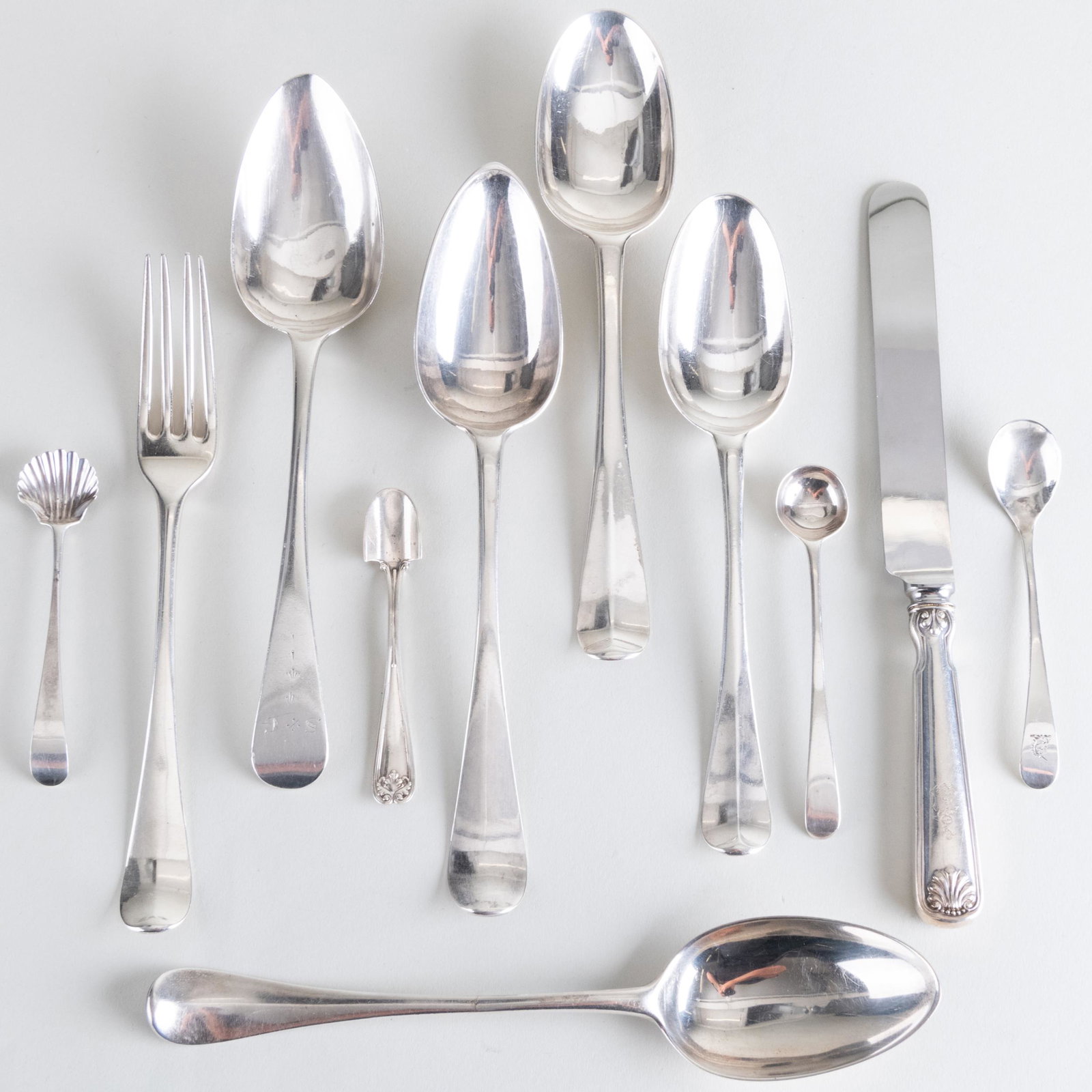 Assembled Silver Flatware Service: Assembled Silver Flatware Service Comprising: A set of eight English dinner forks, indistinctly marked, engraved with crest A set of twelve Tifffany & Co. dinner knives with steel blades, marked 'Ster