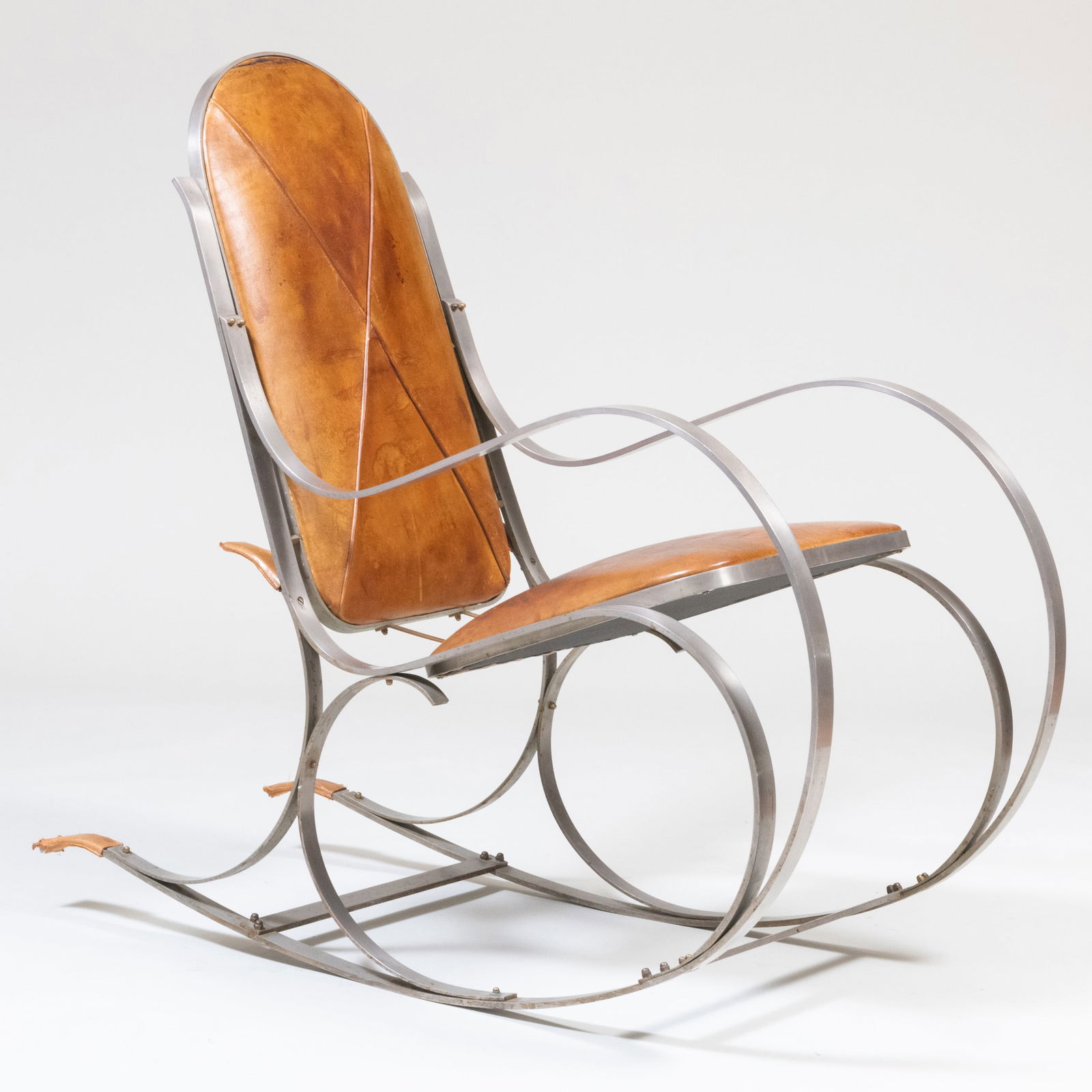 Stainless Steel and Leather Rocking Chair, in the Manner of Thonet: Stainless Steel and Leather Rocking Chair, in the Manner of Thonet Unmarked. 40 1/2 x 20 1/2 x 43 in., seat height 17 1/2 in.