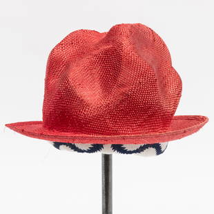 Vivienne Westwood Red Straw Mountain Hat: Vivienne Westwood Red Straw Mountain Hat World's End label. High soft molded crown with narrow brim, padded headband of "squiggle" printed cotton The Collection of Andre Leon Talley