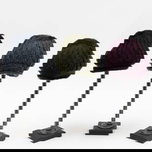 Three Burberry Knit Wool Beanies: Three Burberry Knit Wool Beanies Two with label, one missing (from maroon example). Comprising: one navy blue, one green, and one maroon knit wool beanie hat. The Collection of Andre Leon Talley