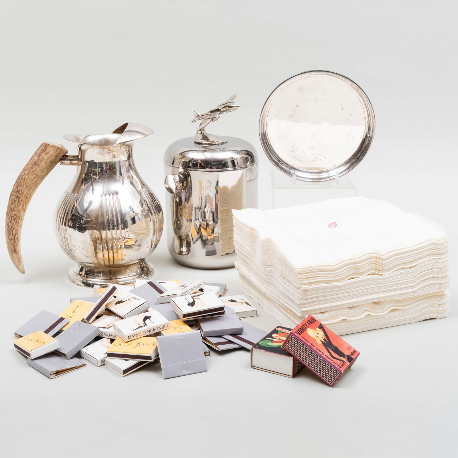 Group of Barware: Group of Barware Comprising: Set of monogrammed paper ALT napkins A group of monogrammed ALT matches A group of Manolo Blahnik matches Two Vanity Fair boxes of matches A metal Savoy bottle coaster An