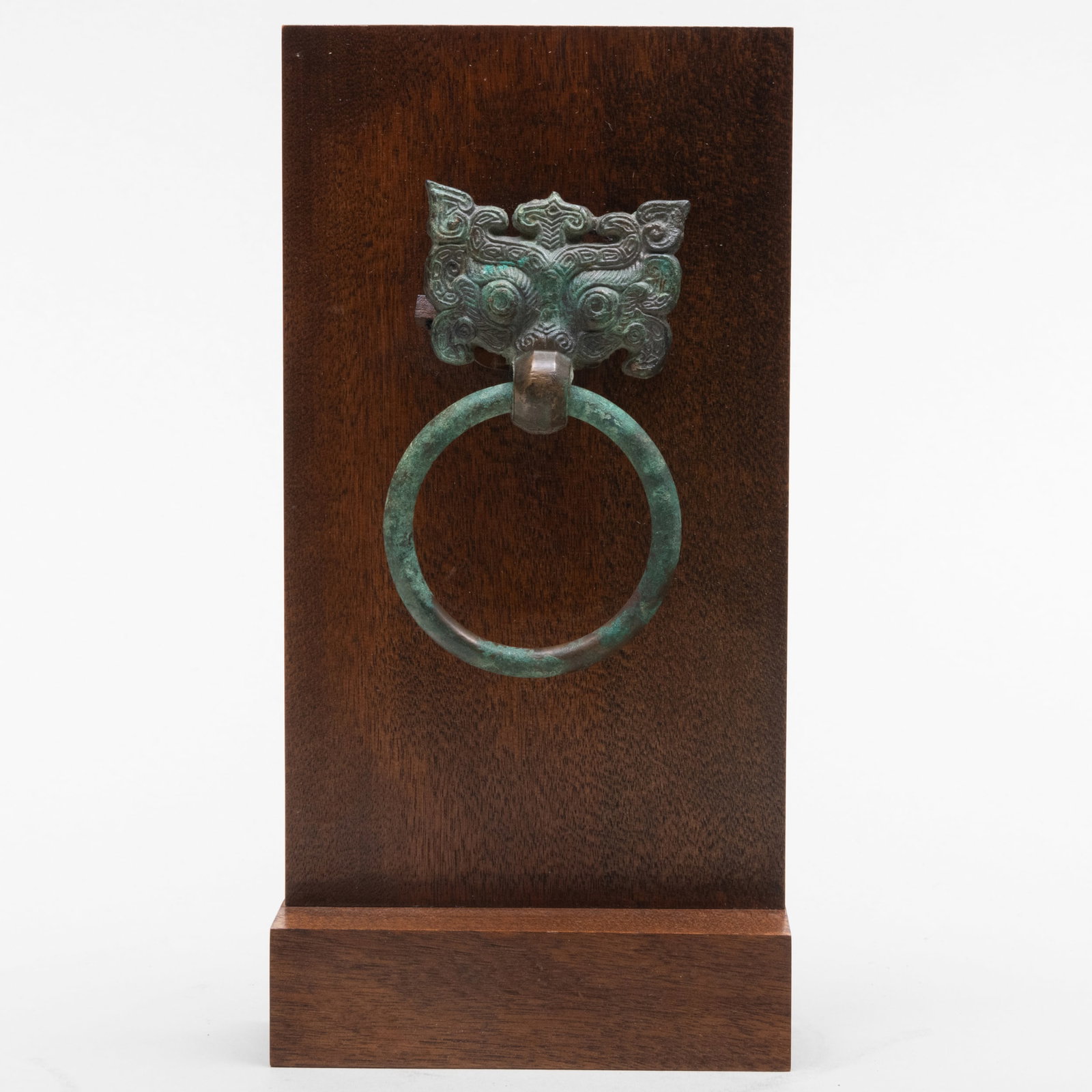 Chinese Bronze Taotie Fitting: Chinese Bronze Taotie Fitting Together with a wood stand. The mask 4 x 2 1/2 in., 8 3/4 x 4 1/2 x 1 5/8 in. (overall).