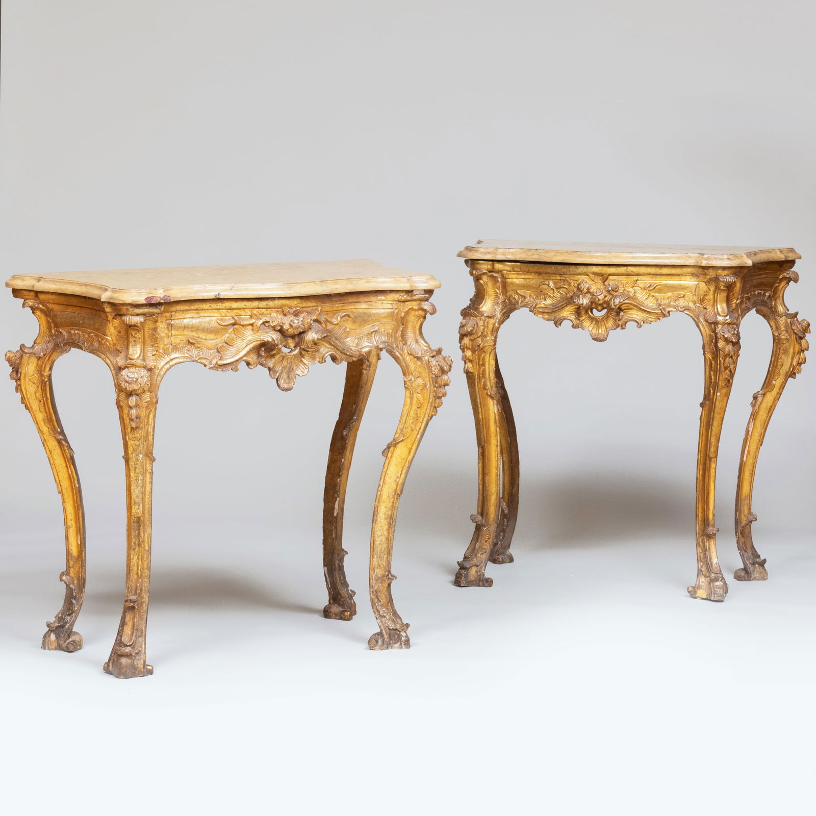Pair of Italian Gilt-Varnished Silver 'Mecca' Console Tables, Naples: Pair of Italian Gilt-Varnished Silver 'Mecca' Console Tables, Naples Each fitted with a molded marble top. 37 1/4 x 39 x 20 1/2 in. Sold Christie's, New York, May 24, 2000, Lot 335.